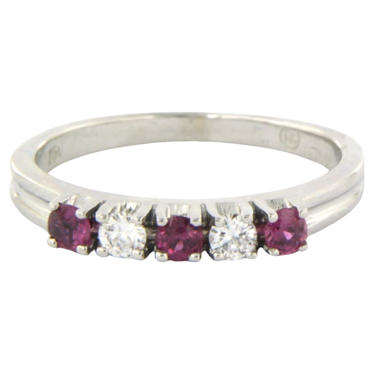 18k white gold ring set with ruby and brilliant cut diamonds up to 0.15ct