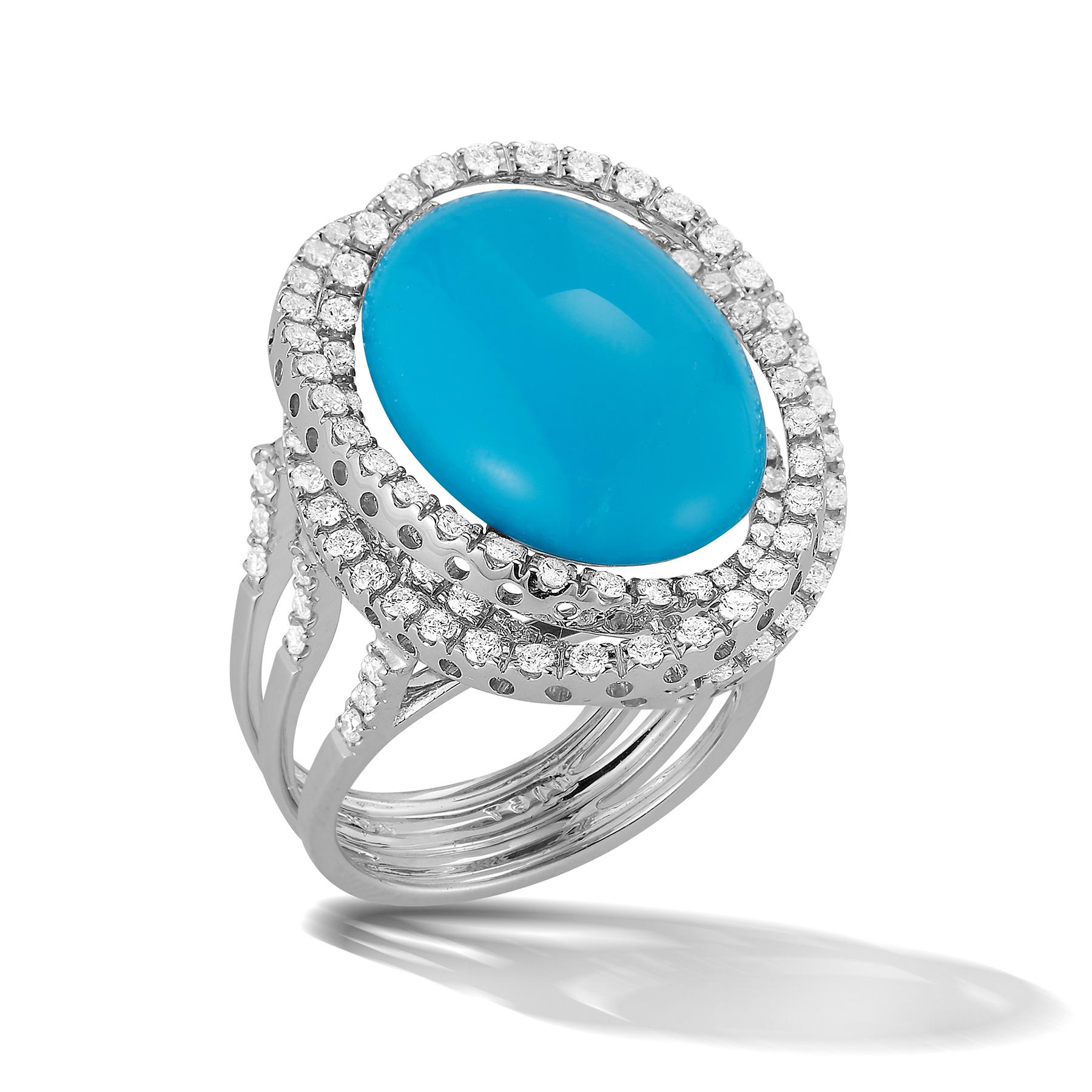 Beautiful 18K White Gold Ring with Impressive 12.54 Carat Aquamarine Cabochon Stone surrounded by 3 halos of 117 dazzling white round diamonds weighing 1.50 carats.