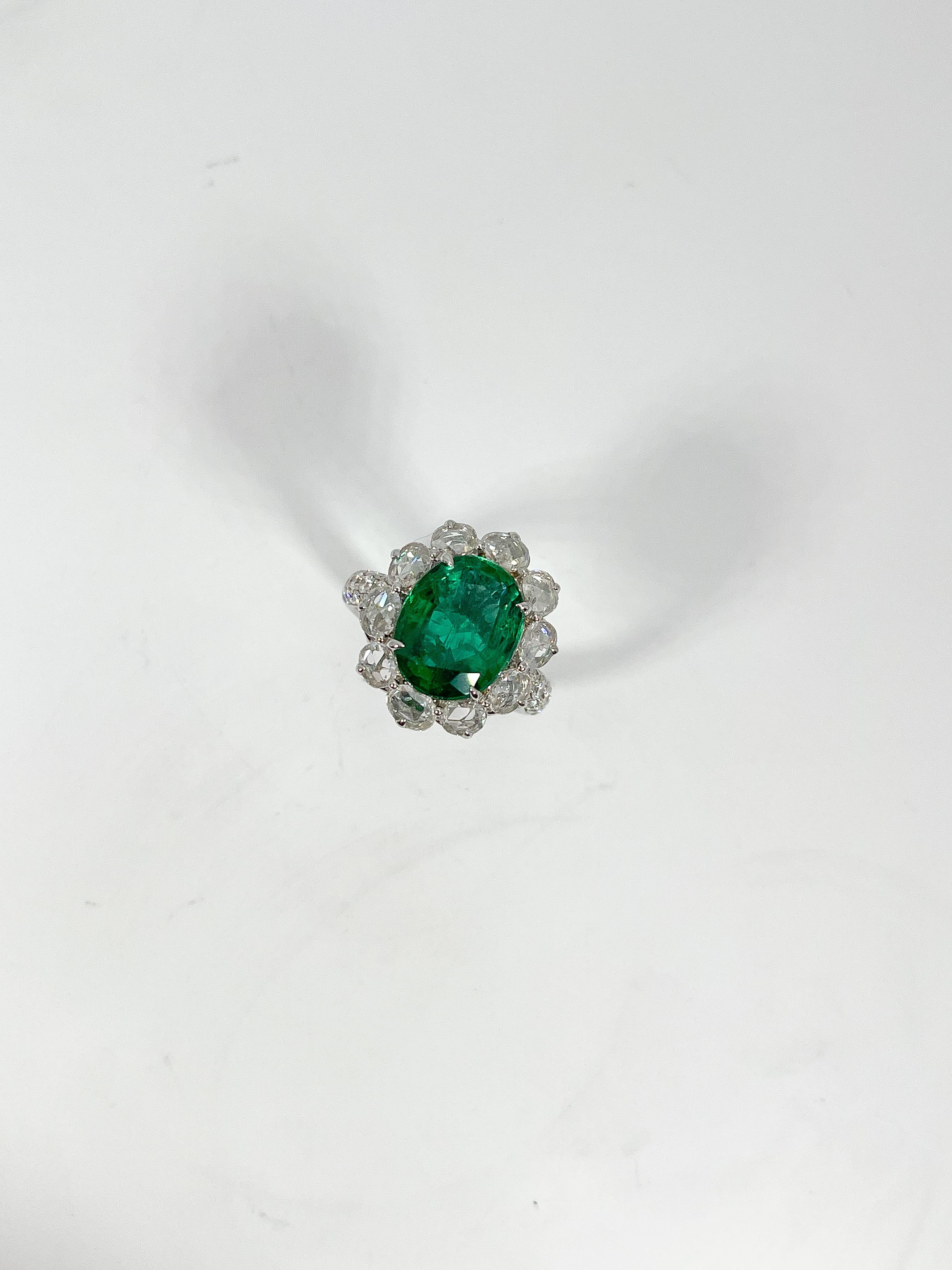 Ladies size 7 18k white gold ring prong and bead set with an oval cut emerald, oval shaped rose cut diamonds and round brilliant cut diamonds. Total item weight is 8.2 grams. Comes with AJI certification.
Emerald Attributes:
Shape and Cut- Oval