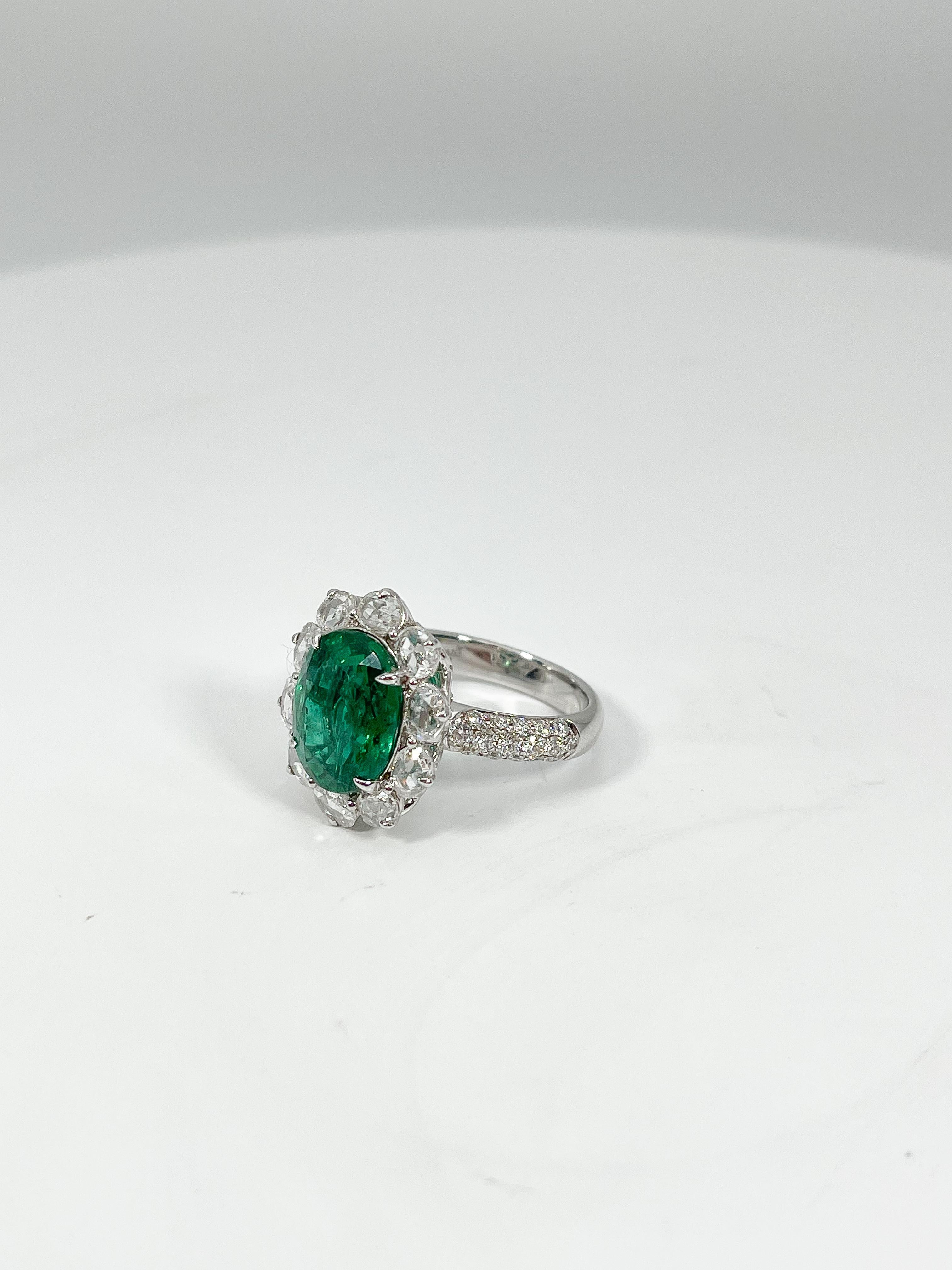 Oval Cut 18K White Gold Ring with 4.62 Emerald and 1.39 CTW Diamonds For Sale