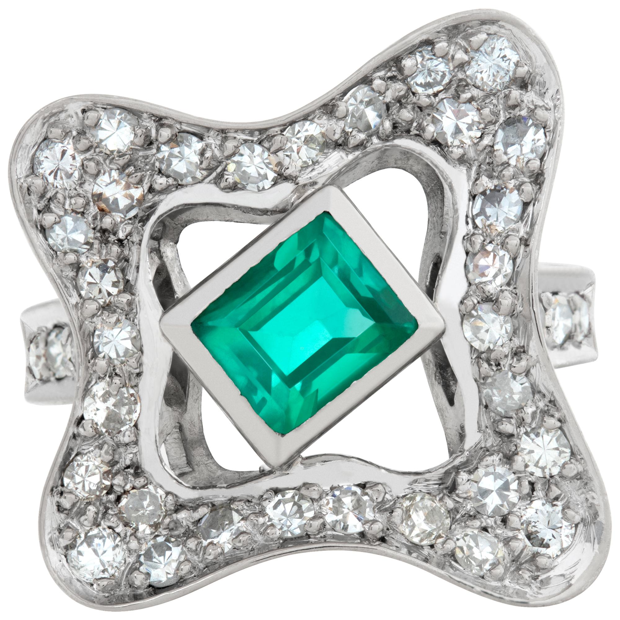 Elegant 18k white gold ring with diamonds and emeralds with approx. 1.50 carat emerald and 0.40 carats in G-H color, VS-SI clarity diamonds. Size 4.5.This Diamond/Emerald ring is currently size 4.5 and some items can be sized up or down, please ask!
