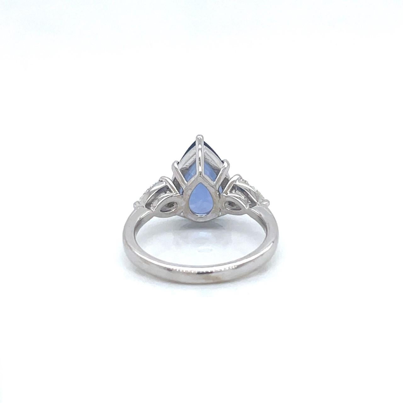 Pear Cut 18k White Gold Ring with One 4.18ct Pear Sapphire and 0.80tcw Pear Diamonds For Sale