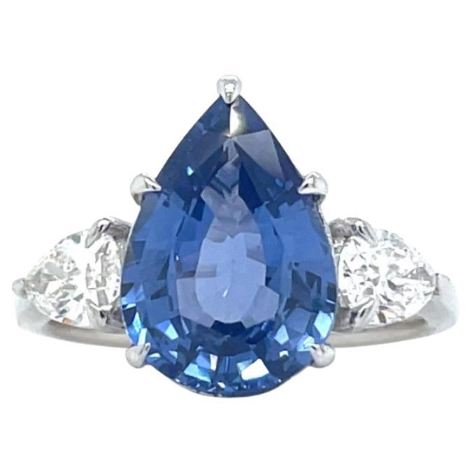 18k White Gold Ring with One 4.18ct Pear Sapphire and 0.80tcw Pear Diamonds For Sale
