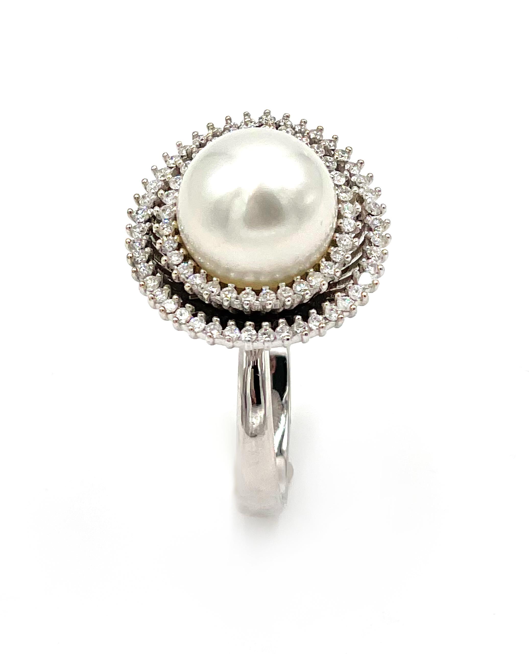 18K White Gold Ring with 76 Round Diamonds 0.60 carat and One Center 11.8mm South Sea Pearl. 

* Finger size 6.75 