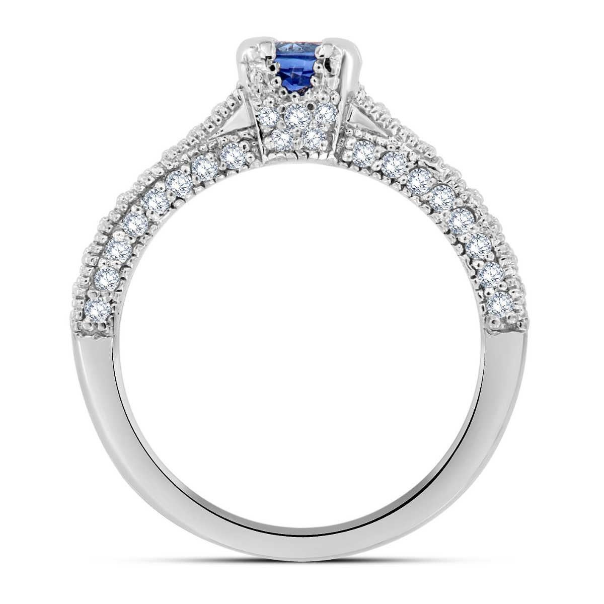 This 18K white gold ring features a 0.63-carat round-shaped Sri-Lankan Blue Sapphire. An elegant drape of 0.54 carat Pave' -set diamonds along three sides of the shank, and the crown completes this stunning ring. Experience the difference in