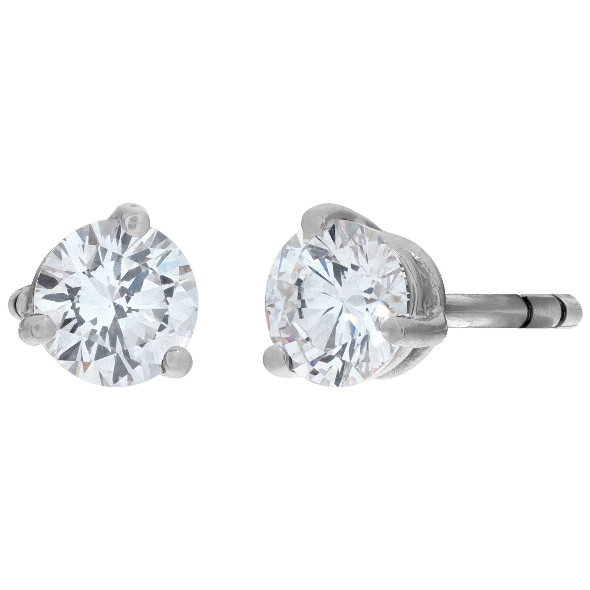 Round brilliant diamonds studs earrings with security French push back. Round brilliant diamons approx. weight: 1 carat, estimate G-H color, VS clarity.
