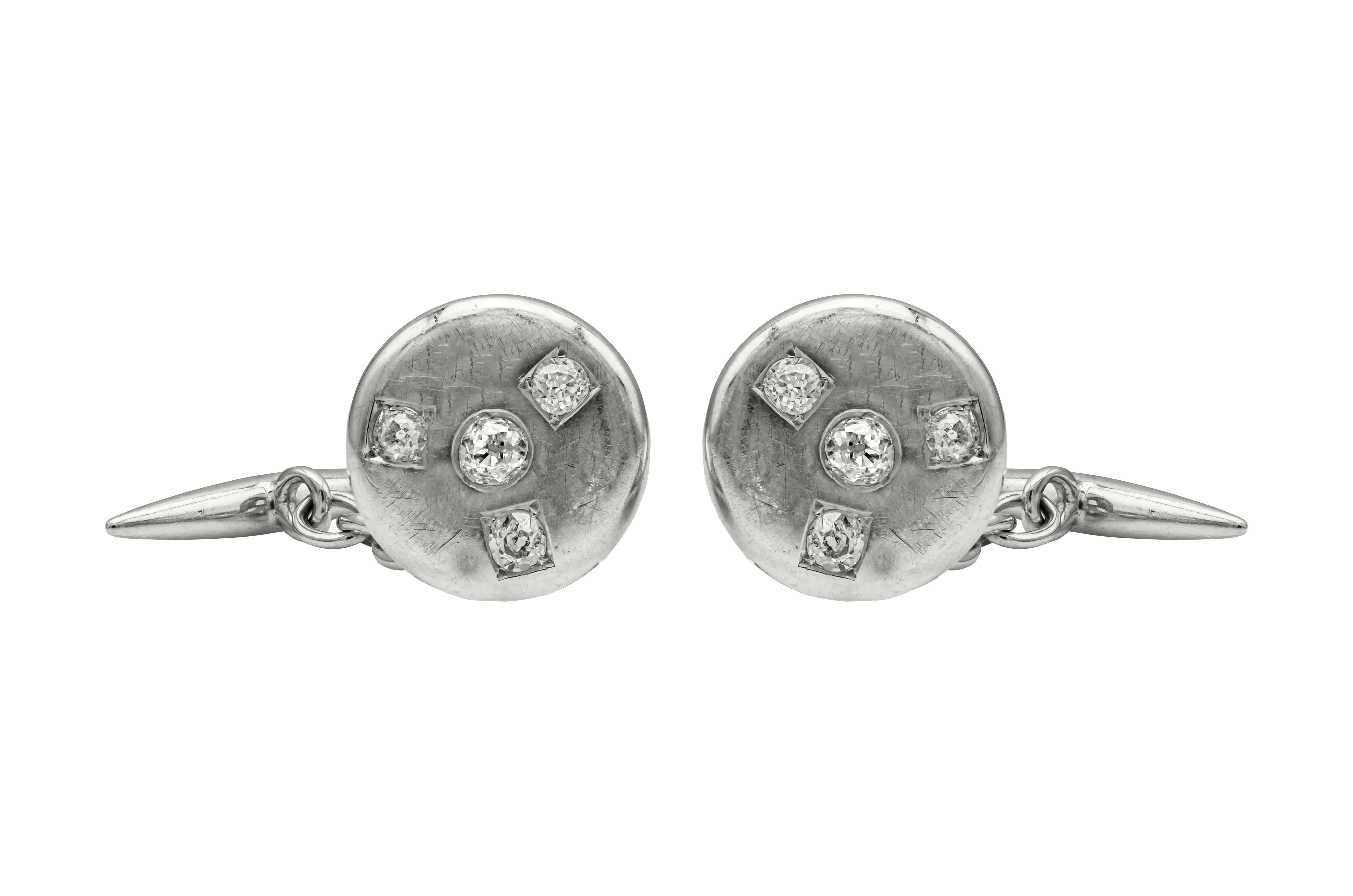 Showcasing a vintage piece of cufflinks accented with 8 antique old European Cut diamond weighing 1 carats total, set in a chain link design between the disc and bar. Finely made in 18k white gold.