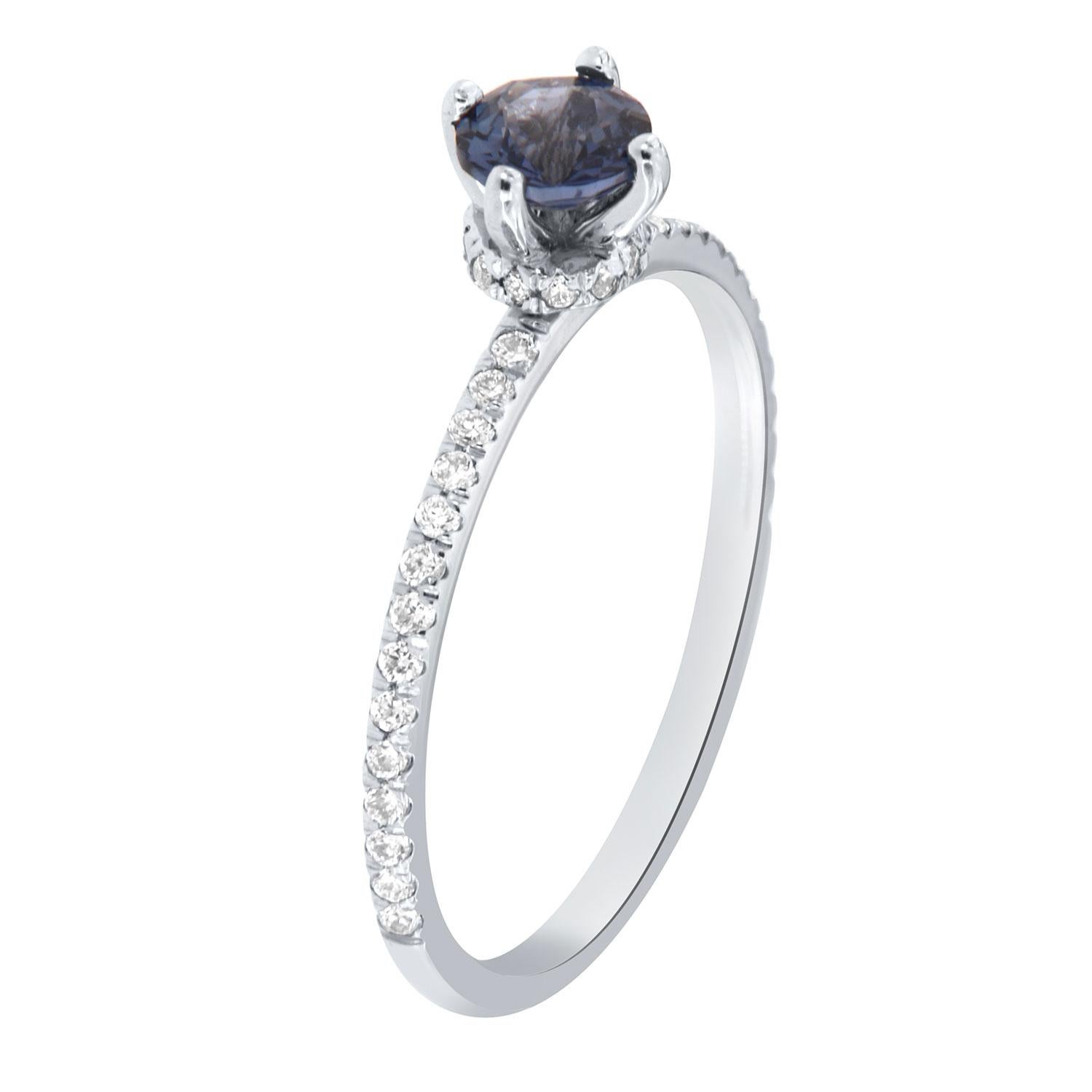 This delicate 18k white gold ring features a 0.51-Carat natural Diamond-cut Round shape  Sri-Lankan Sapphire encircled by a hidden halo of brilliant round diamonds on top of a 1.4 MM wide diamond band.
This beautiful Sapphire exhibits a vibrant blue
