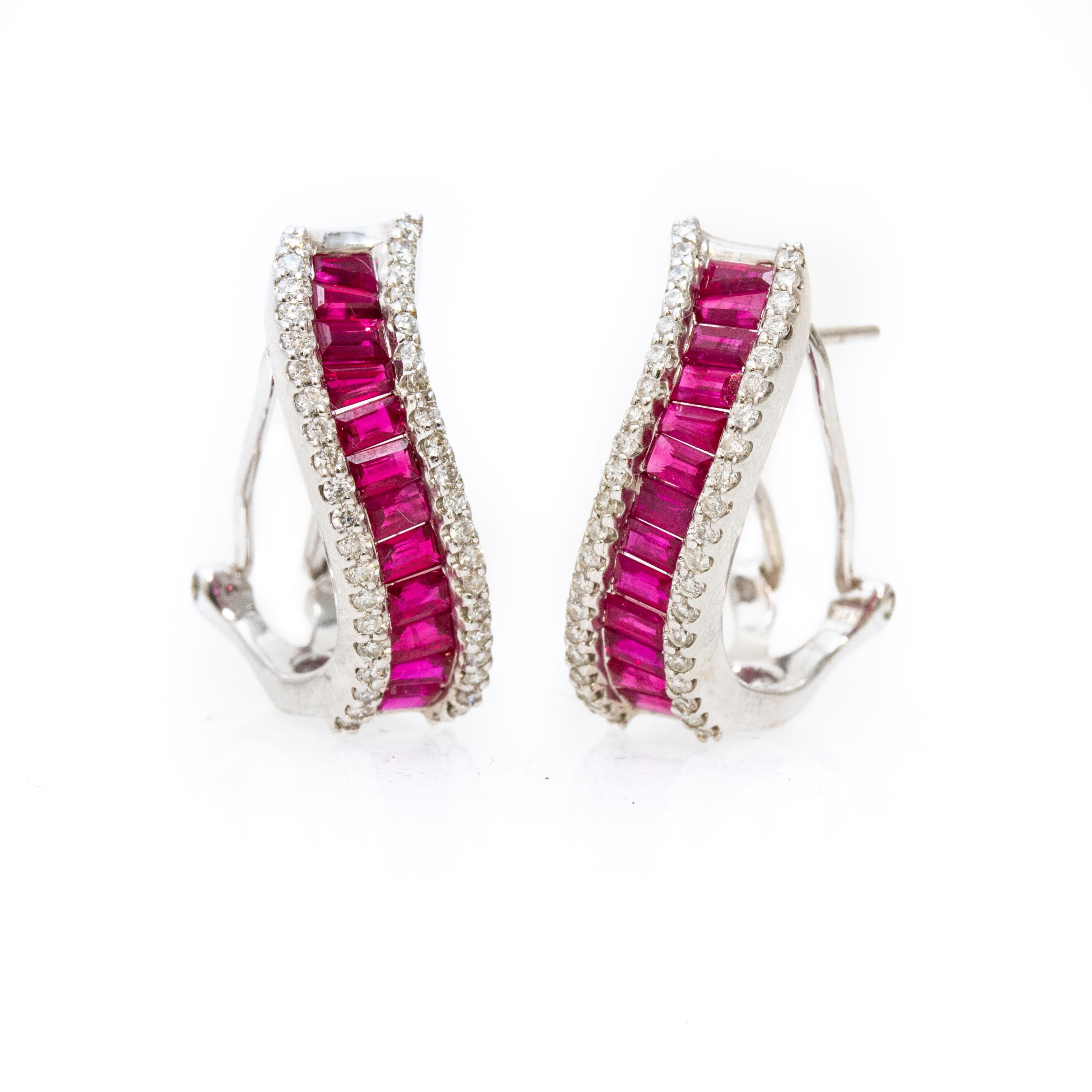 Offered is a pair of 18k white gold ruby and diamond clip earrings with over 100 stones 4.2dwt