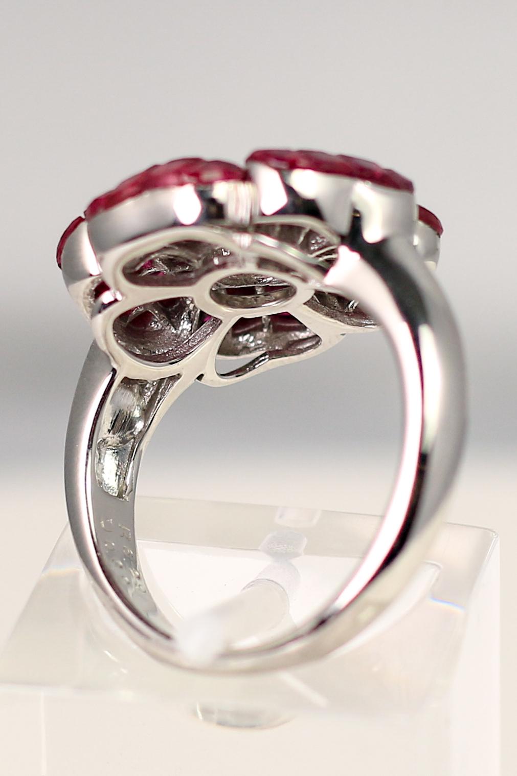 This flower ring, of 18k White Gold with 6.29cts of invisibly set Rubies and sparkling Diamonds is sure to be a stunning addition to any fun, fragrant, floral ensemble. The perfect piece to gift for that special someone, or yourself. The ring is