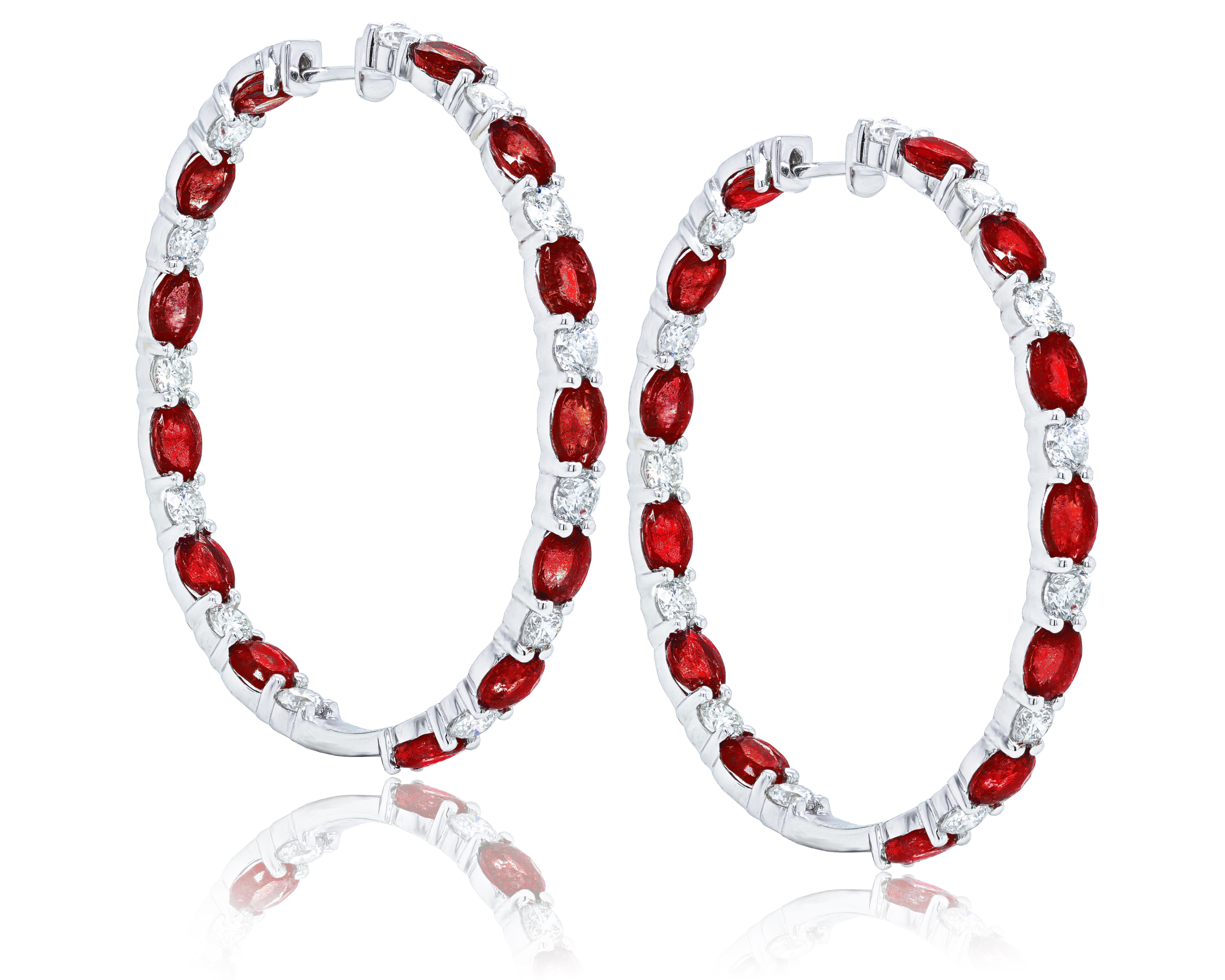 18 Karat White gold Ruby and Diamond Hoop Earrings features 10.66 Carats of Rubies and 3.16 Carats of Diamonds. 