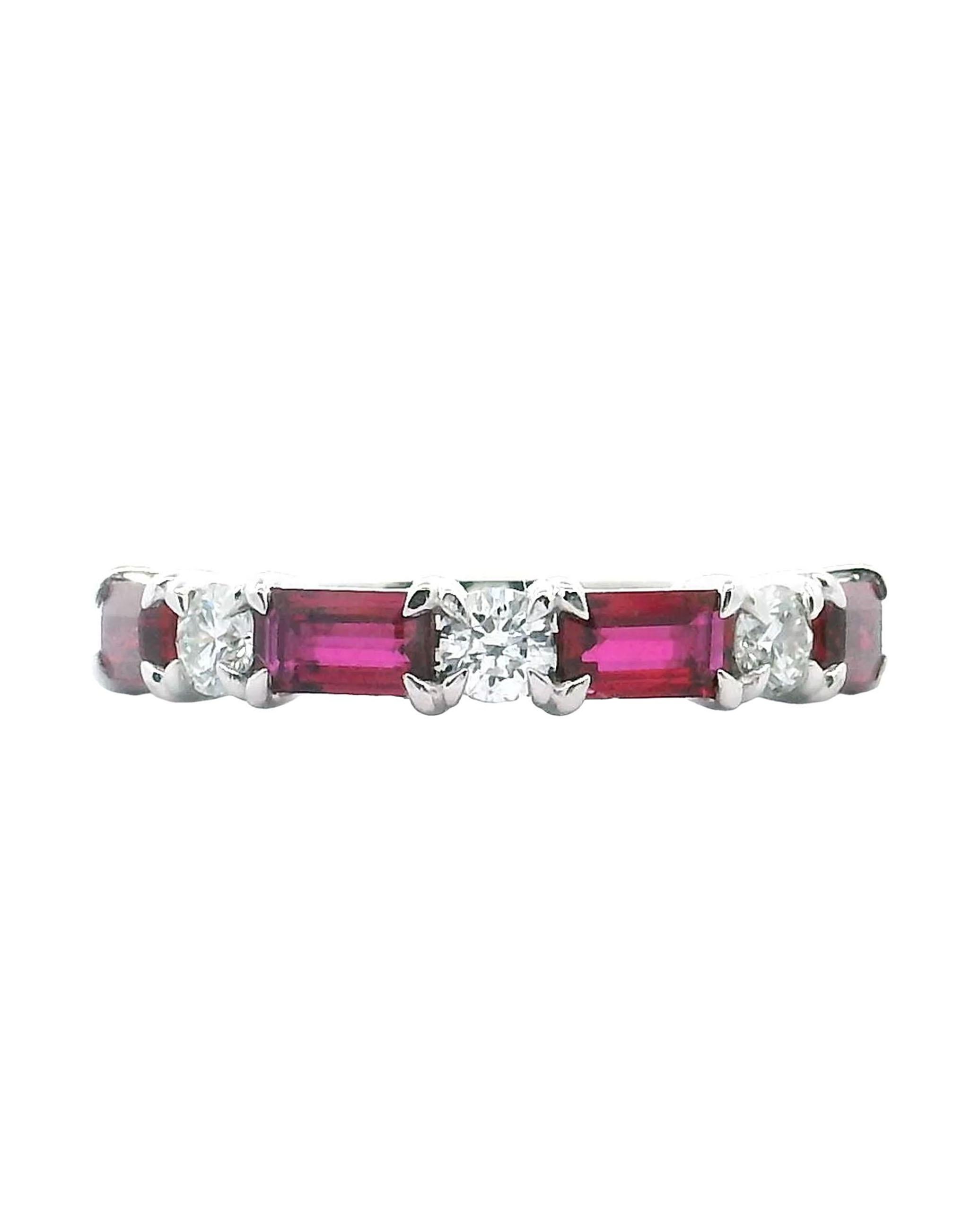 18K white gold ring with 4 emerald-cut rubies weighing 1.09 carats total and 3 round brilliant-cut diamonds weighing 0.34 carats total. (F/G color, VS2/SI1 clarity)

* Finger size 6.5
* Diamonds are G/H color, SI1 clarity.