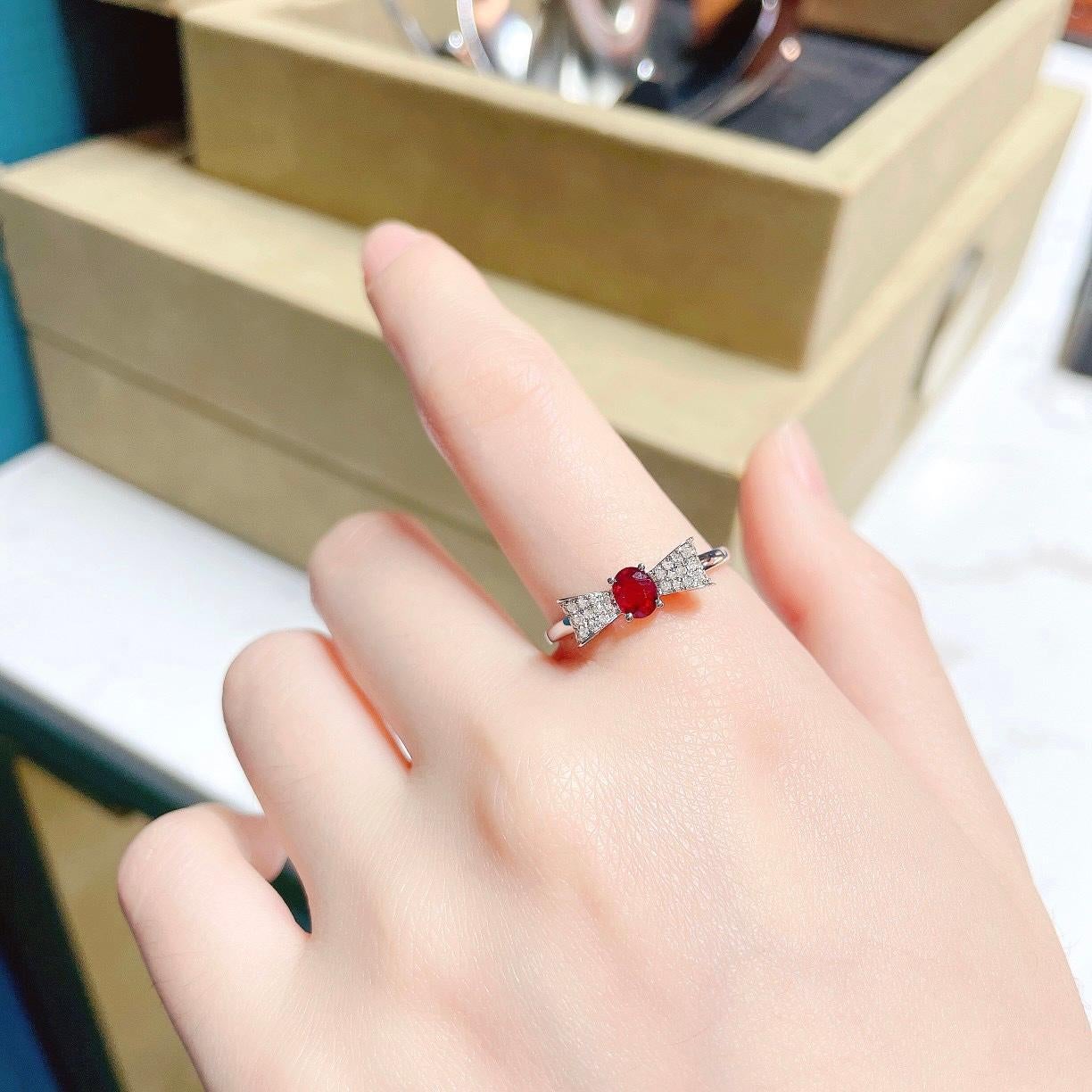 Oval Cut 18K White Gold Ruby Bow Ring with Diamonds For Sale