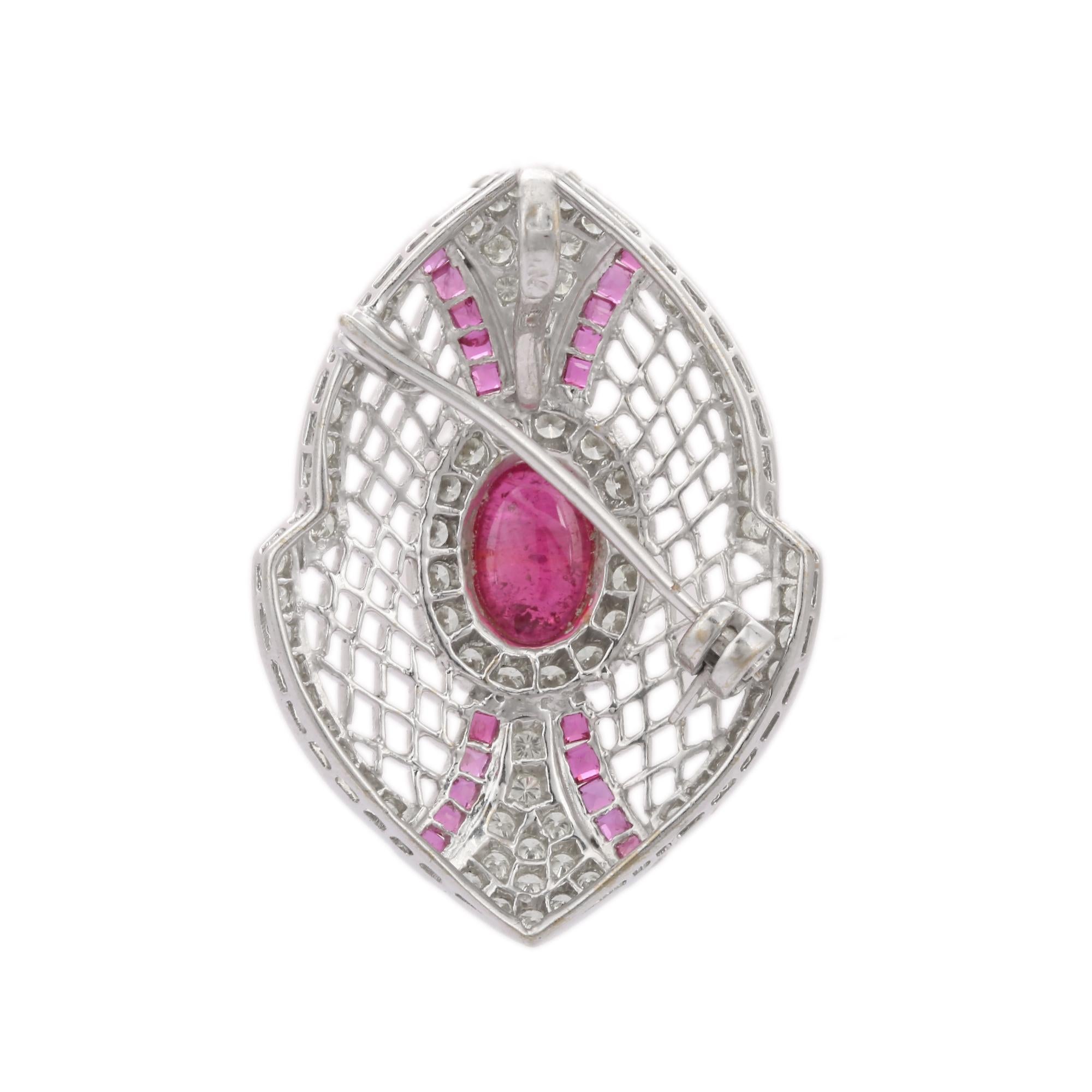 Unisex Fine Jewelry, Ruby Diamond Brooch Made in 18K Gold which is a fusion of surrealism and pop-art, designed to make a bold statement. Crafted with love and attention to detail, this features 6.91 carats of ruby which makes you stand out of the