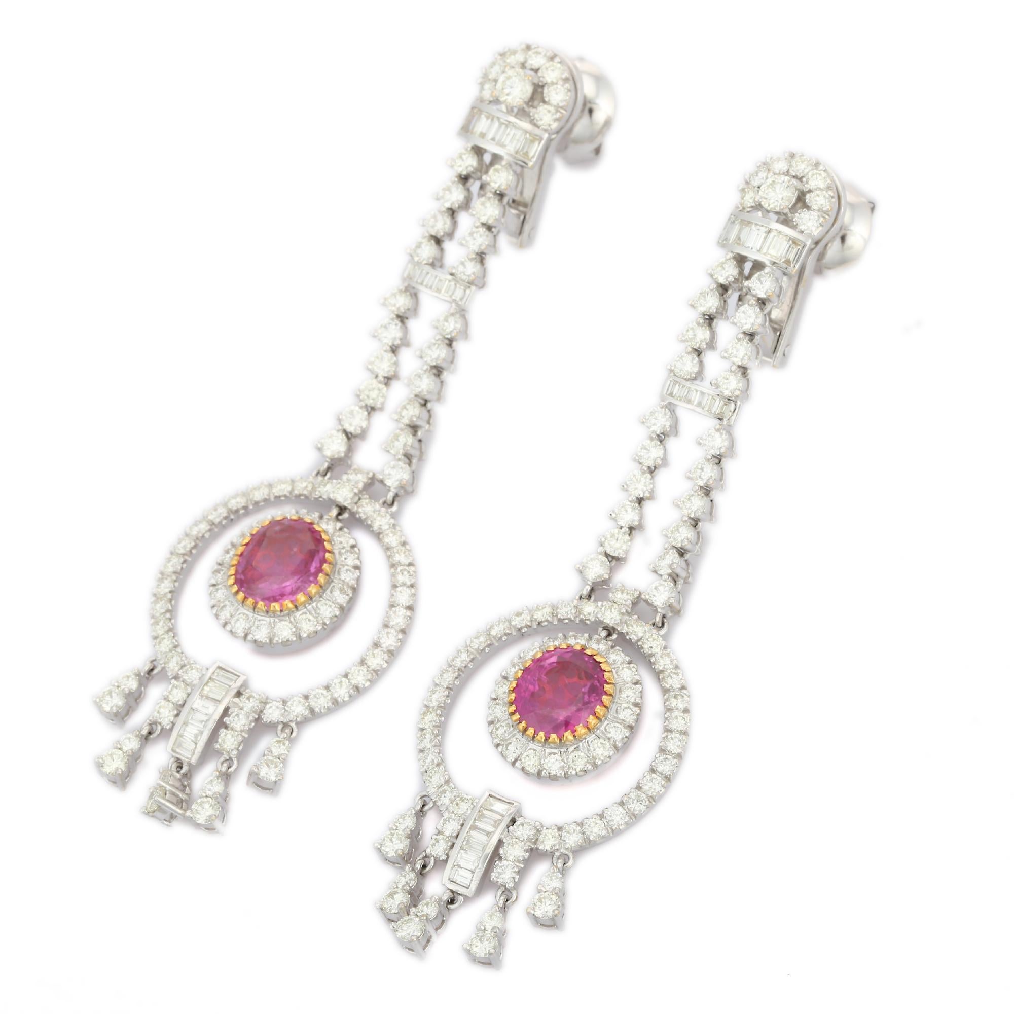 Glamorous Diamond Ruby Dangle Earrings in 18K Gold to make a statement with your look. You shall need statement dangle earrings to make a statement with your look. These earrings create a sparkling, luxurious look featuring round cut rubies.
Ruby