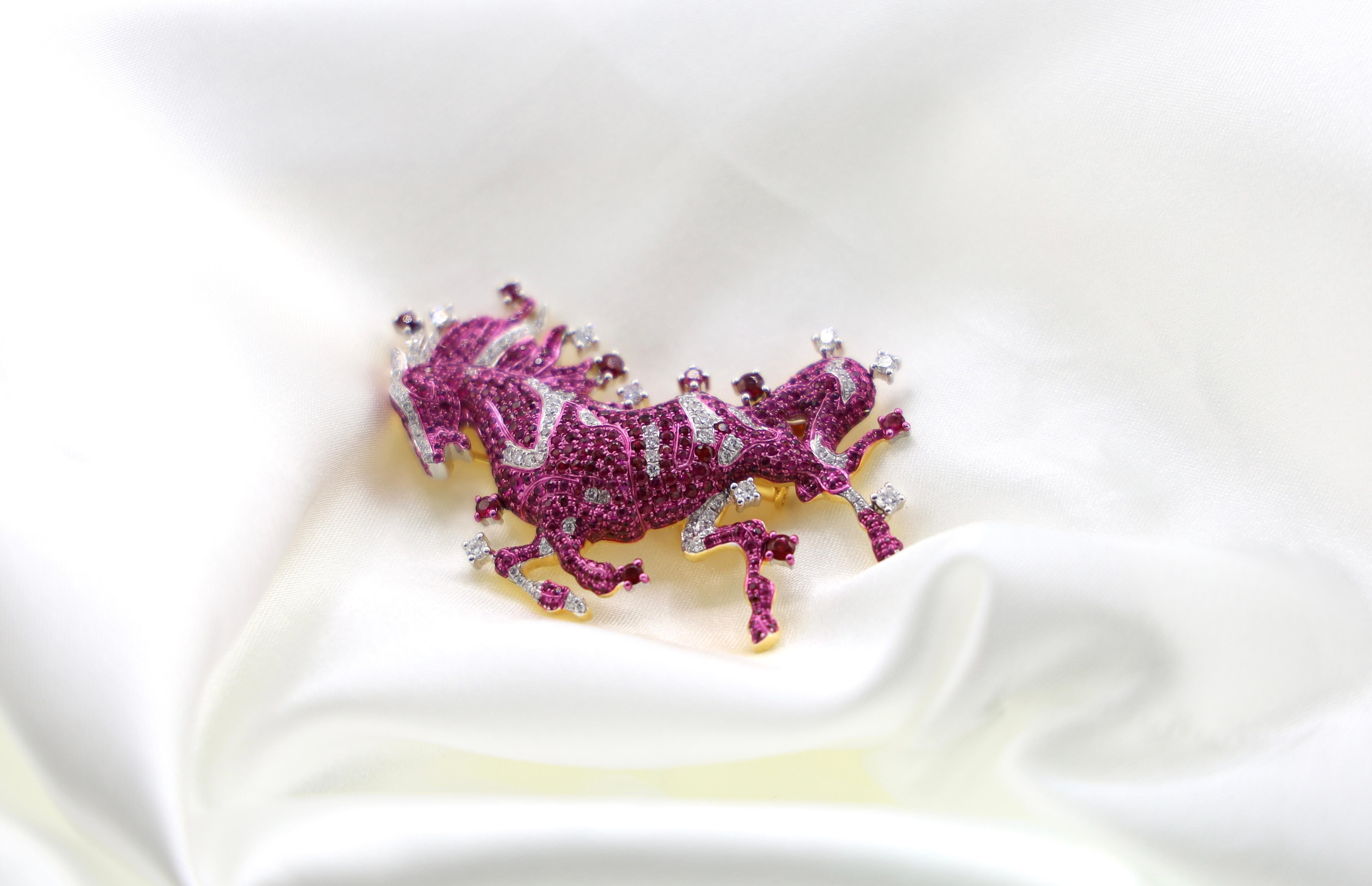 18K White Gold Ruby & Diamond Horse Brooch & Pendant

98 Diamonds - 0.774 CT
502 Rubies - 3.688 CT
18K Gold - 19.52 GM

This exquisite ruby brooch is a true work of art, evoking a sense of poetic wonder and dreamlike enchantment. The centerpiece is