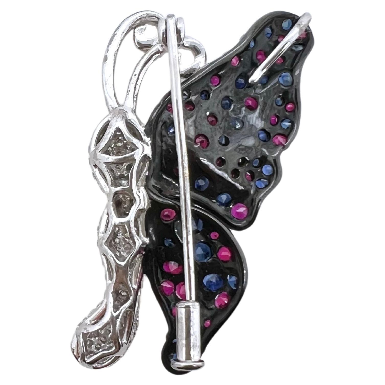 This 3 dimensional butterfly brooch and pendant is a piece of art! The vibrant blue sapphires and rubies that make up the wings are set behind the bright, white round brilliant diamonds to give a dramatic contrast! The versatility of the butterfly
