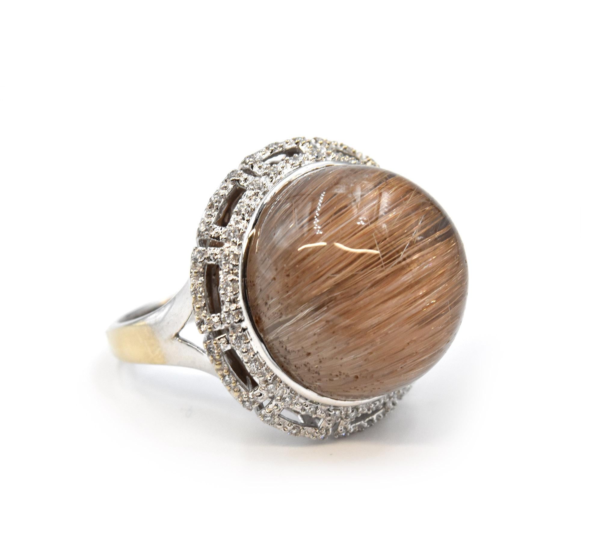 Designer: custom design
Material: 18k White Gold
Rutilated Quartz: 30.15ct
Diamonds: 120 Round Diamonds = .60cttw
Color: H
Clarity: SI1
Ring Size: 9.25 (please allow two additional shipping days for sizing requests)
Weight: 12 grams
Dimensions: 24mm