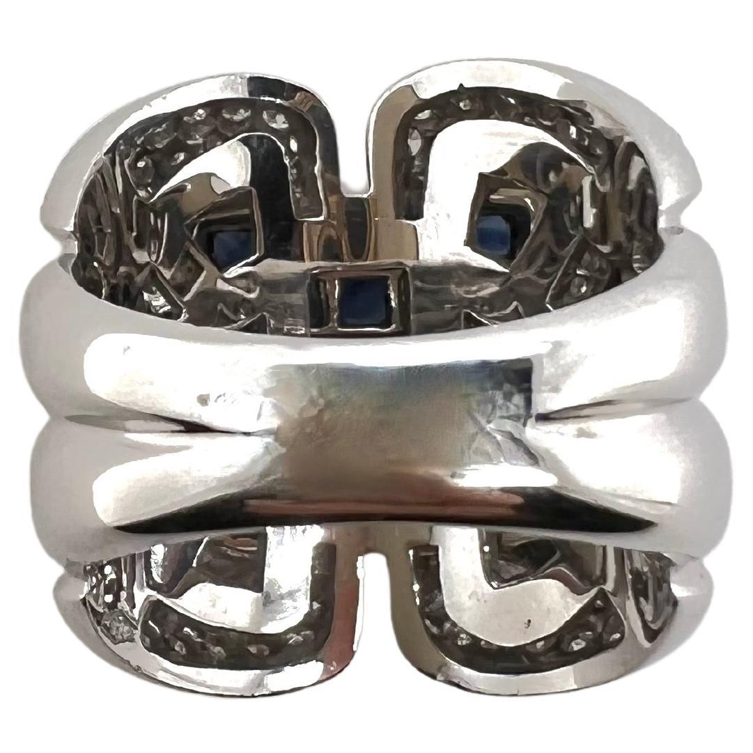 This stunning band contains invisible set sapphires in the center that is surrounded by pavé set diamonds on the edges.  This wide, cigar band-style ring is a knockout piece and will grasp everyone's attention!


Sized: 6.5n / can be sized
Stone: