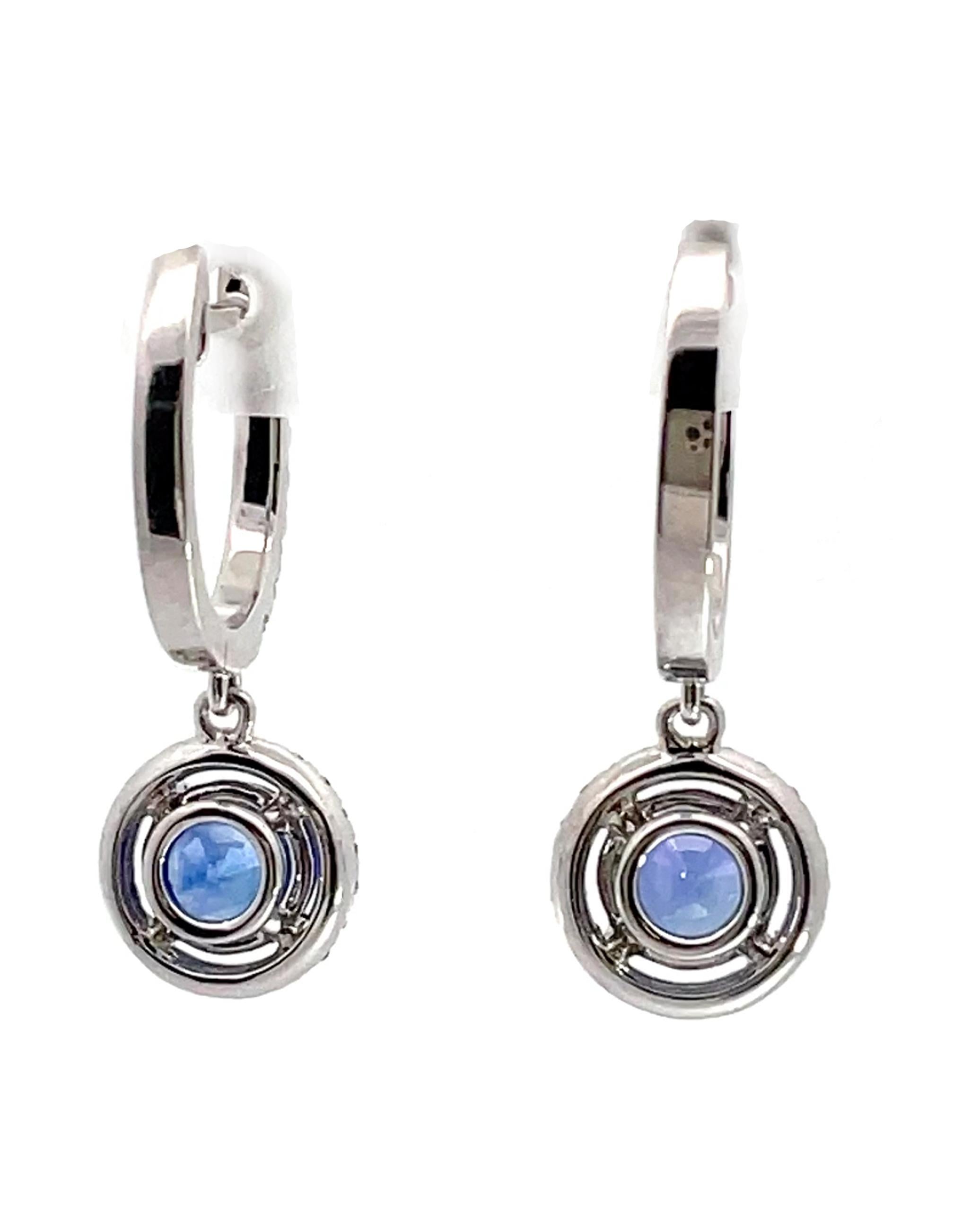 18K white gold drop earrings with 64 round brilliant-cut diamonds weighing 0.53 carats total weight and 2 round faceted blue sapphires weighing 2.07 carats total.

* Diamonds are G/H color, SI1 clarity.
