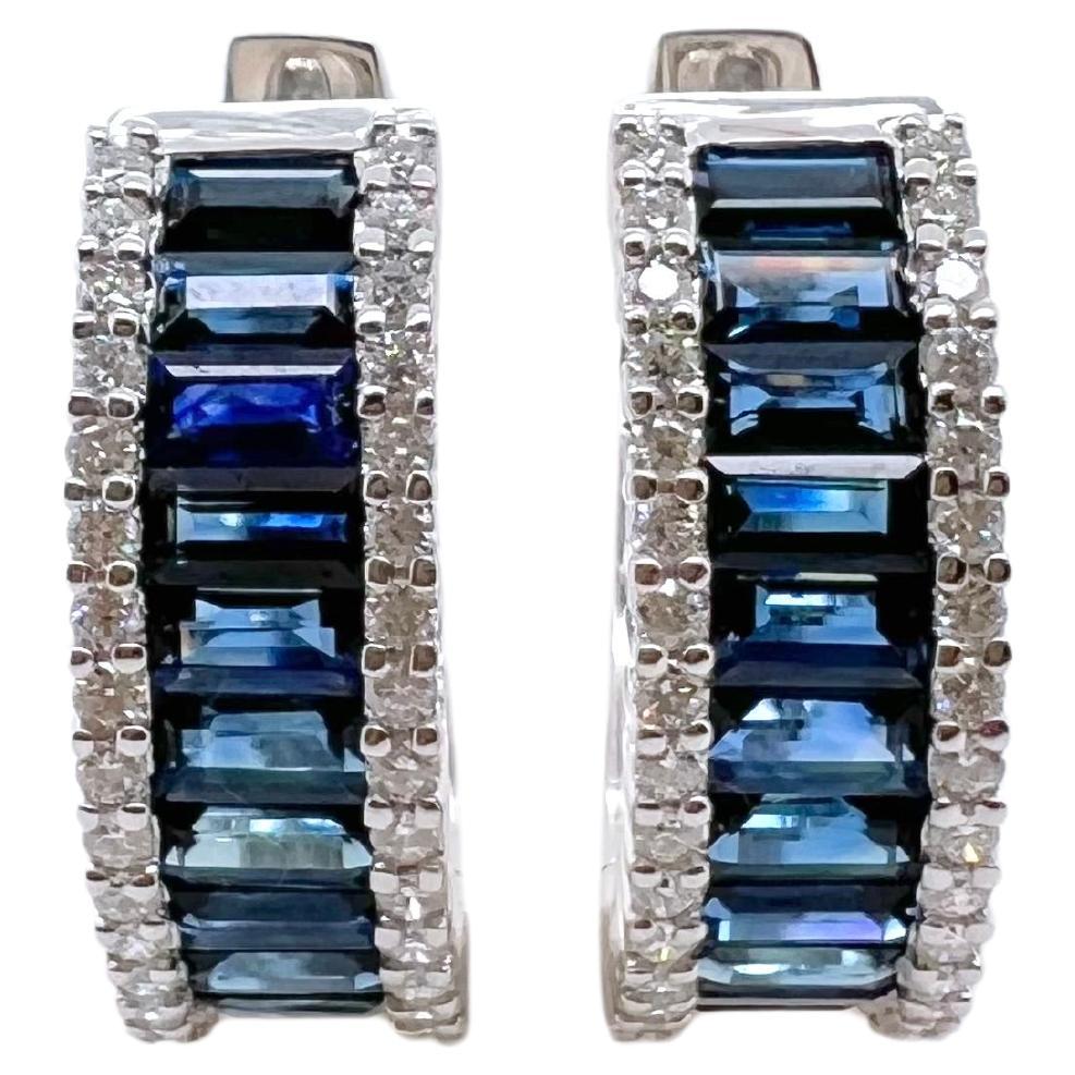 These gorgeous sapphire hoop earrings are set in 18k white gold with round brilliant diamonds on the shoulders.  The sapphire stand out against the white gold and are perfect for the smart casual look!


Stone: Sapphire 3.97 cts, Baguette
Diamonds:
