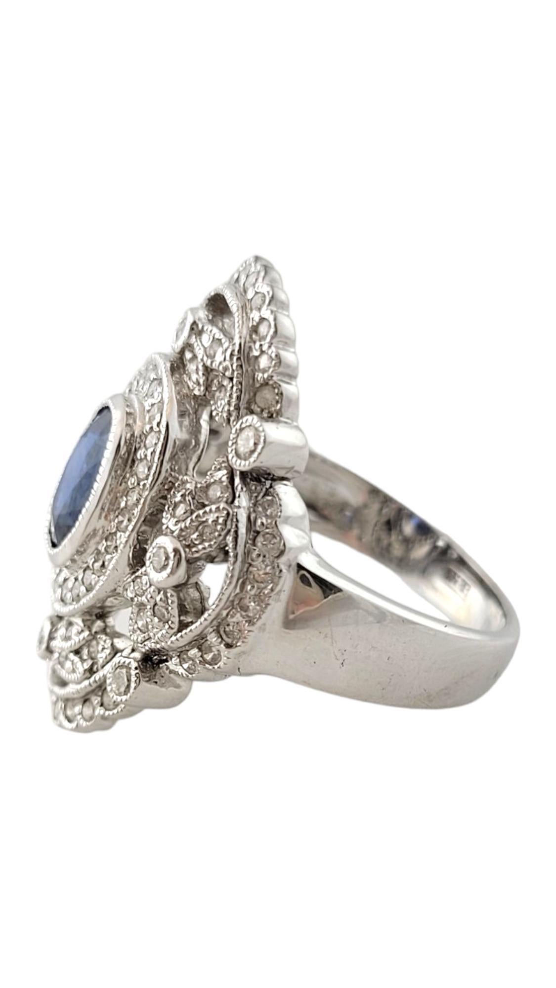 Vintage 18 Karat White Gold Sapphire and Diamond Ring Size 7-

This spectacular ring features one oval sapphire (approx. 7 mm x 5 mm) and 64 round brilliant cut diamonds set in beautifully detailed 18K white gold.  

Natural oval blue sapphire is