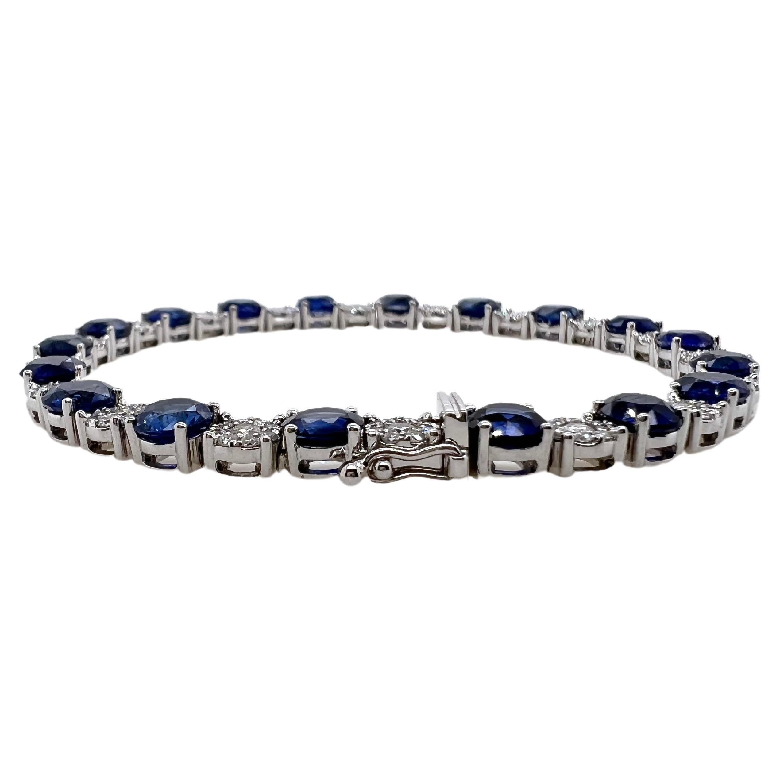 This iconic sapphire and diamond alternating pattern tennis bracelet is breathtaking!  The round, beautiful color sapphire are contrasted by the illusion set diamonds.  The diamonds are actually a small diamond, surrounded by a halo of smaller