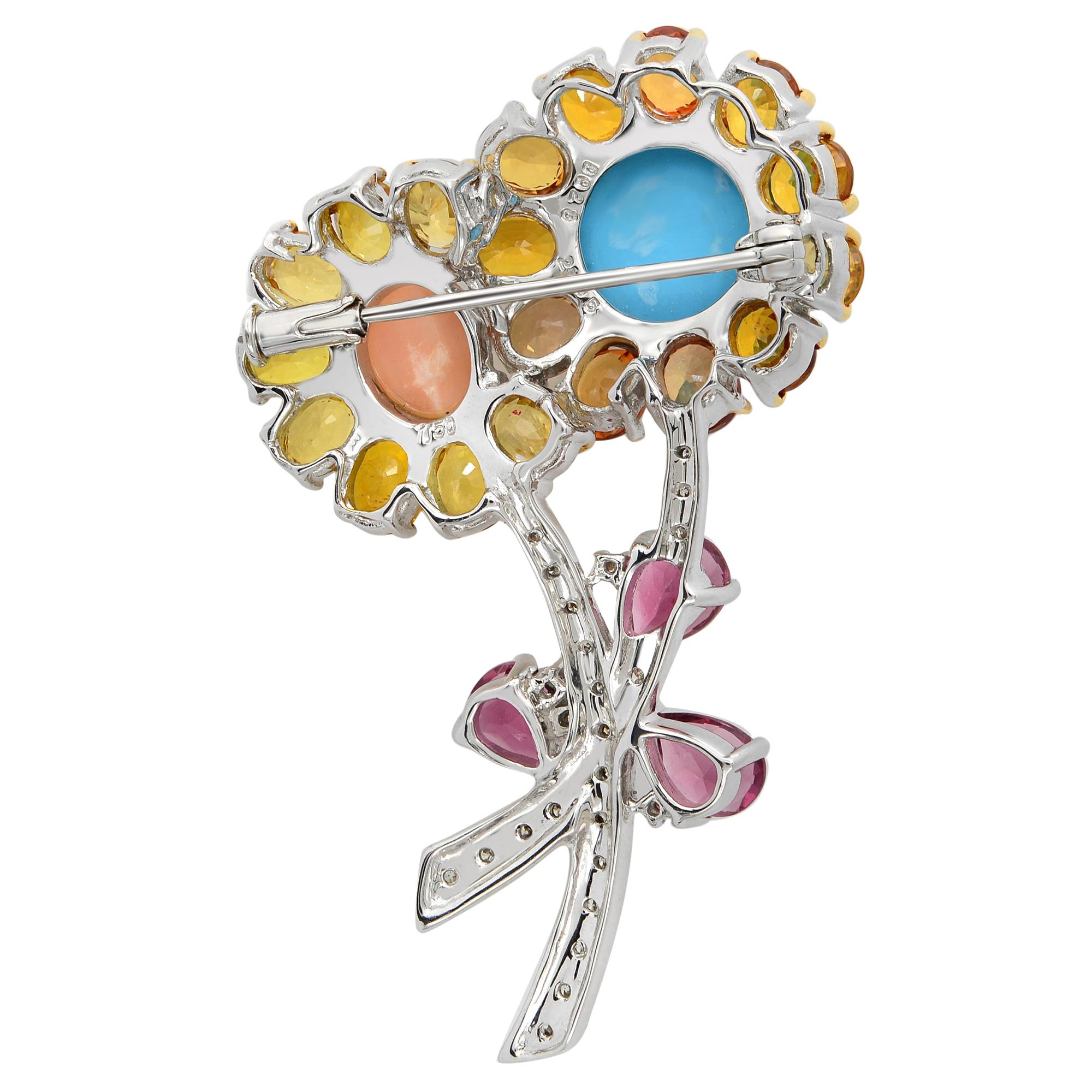 Spring has eternally sprung in this bright and colorful flower brooch. The 18 karat white gold stems blossom with shimmering pave diamonds, centered with coral and turquoise surrounded by yellow and orange citrines, that match with color sapphire