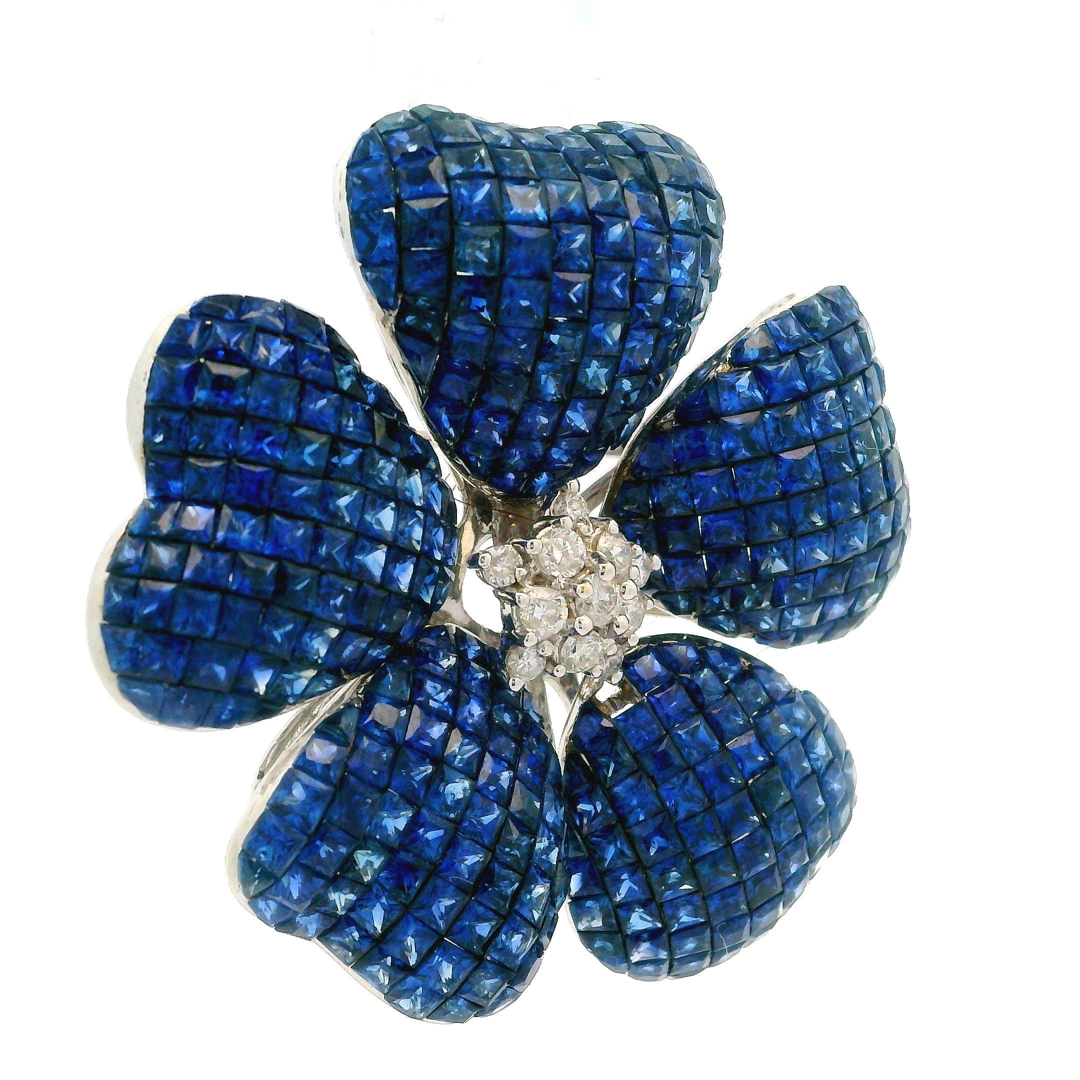 --Stone(s):--
Numerous Natural Genuine Sapphires - Square Step Cut & Calibre Cut - Mystery Invisible Set - True Royal Blue Color
(11) Natural Genuine Diamonds- Round Brilliant Cut - Prong Set - White Color - 0.20ctw (approx.)

Material: 18K Solid