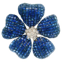 Colgante Broche Flor Invisible Engastado Misterioso de Zafiro y Diamantes en Oro Blanco de 18k