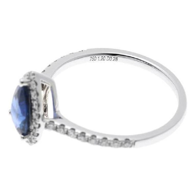 Introducing our stunning pear-shaped sapphire diamond ring, crafted with elegance and sophistication. This exquisite piece features a lustrous sapphire center stone, weighing 1.20 carats, surrounded by sparkling diamonds totaling 0.28 carats. Set in