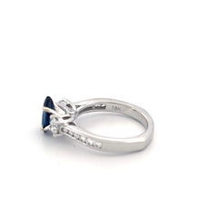 Elegant Platinum Three-Stone Ring with Marquise Sapphire & Diamonds