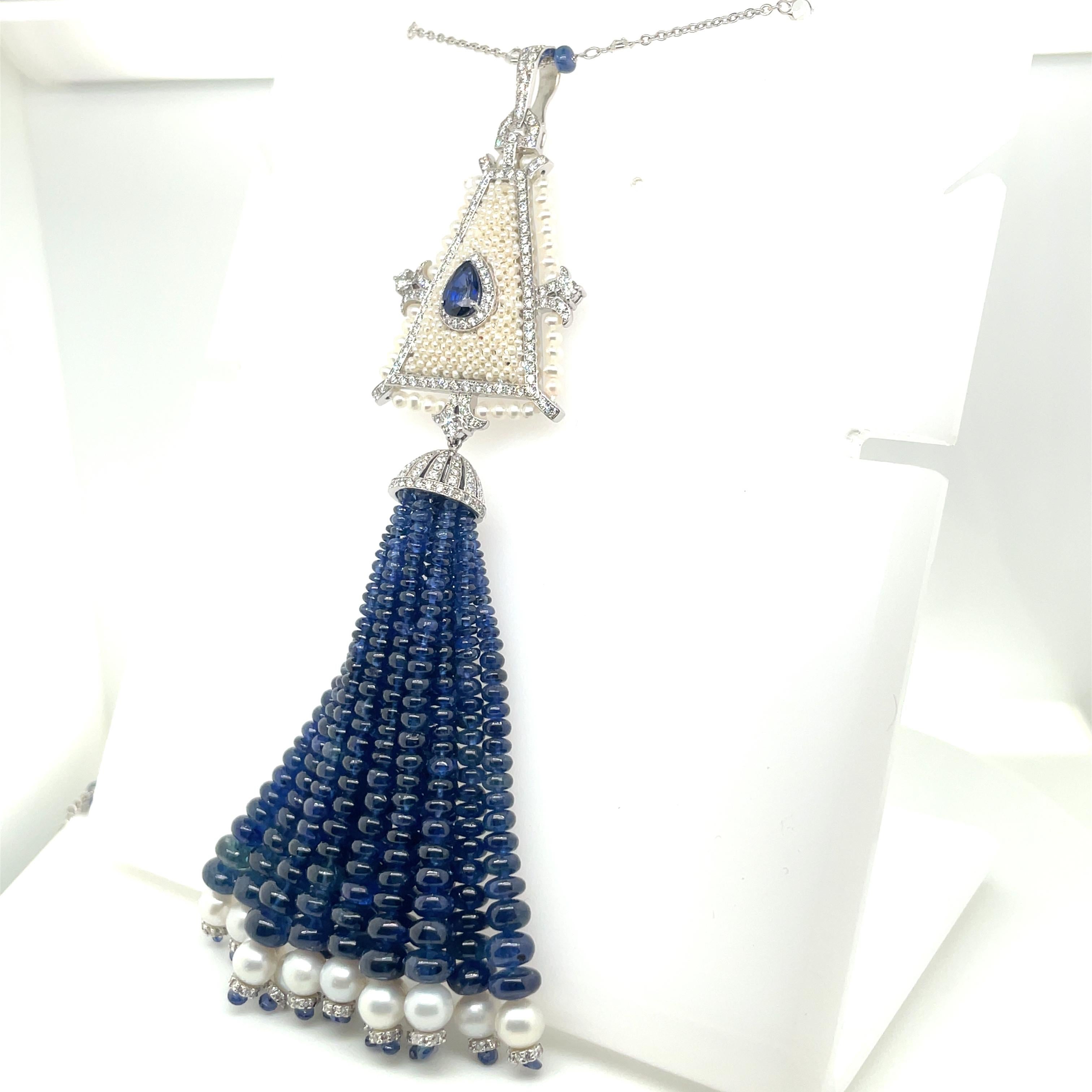 This exquisite tassel necklace is crafted from 18K white gold. 

Showcasing a harmonious blend of sophistication and charm, this piece features 130.36 carats of sapphire beads, radiating a deep, captivating allure.

Adding a touch of grace are the