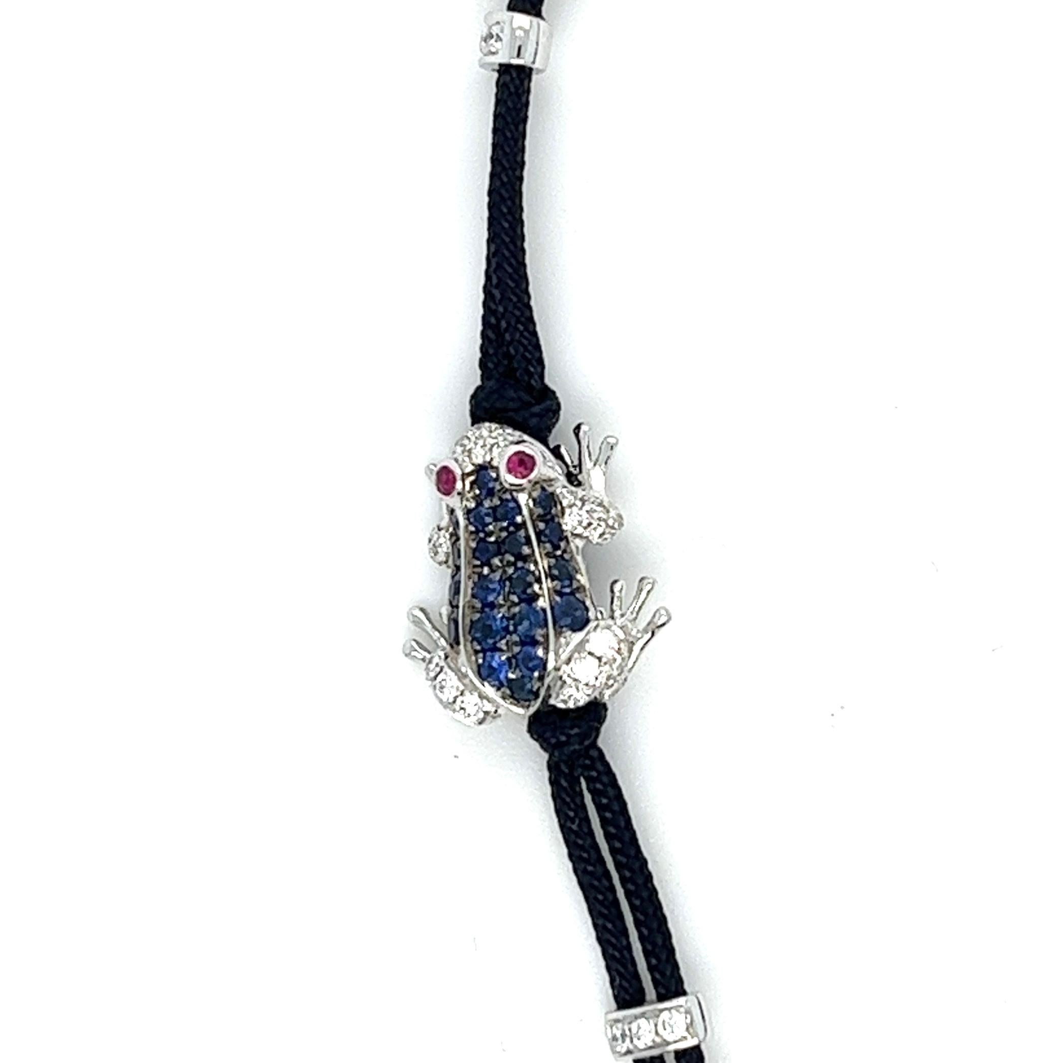 18K White Gold Sapphire Frog Woven Bracelet with Diamonds & Rubies

2 Rubies - 0.02 CT
20 Sapphires - 0.20 CT
37 Diamonds - 0.16 CT
18K White Gold - 2.50 GM

This exquisite braided bracelet features a stunning frog made of rubies, set in 18K gold,
