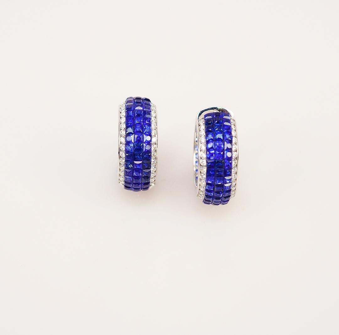 This hoop earrings we are special design .The outside we use invisible setting of deep blue sapphire and we also put the light blue round sapphire inside the hoop too.It is very in detail and delicate workmanship.We set the stone in perfection as we