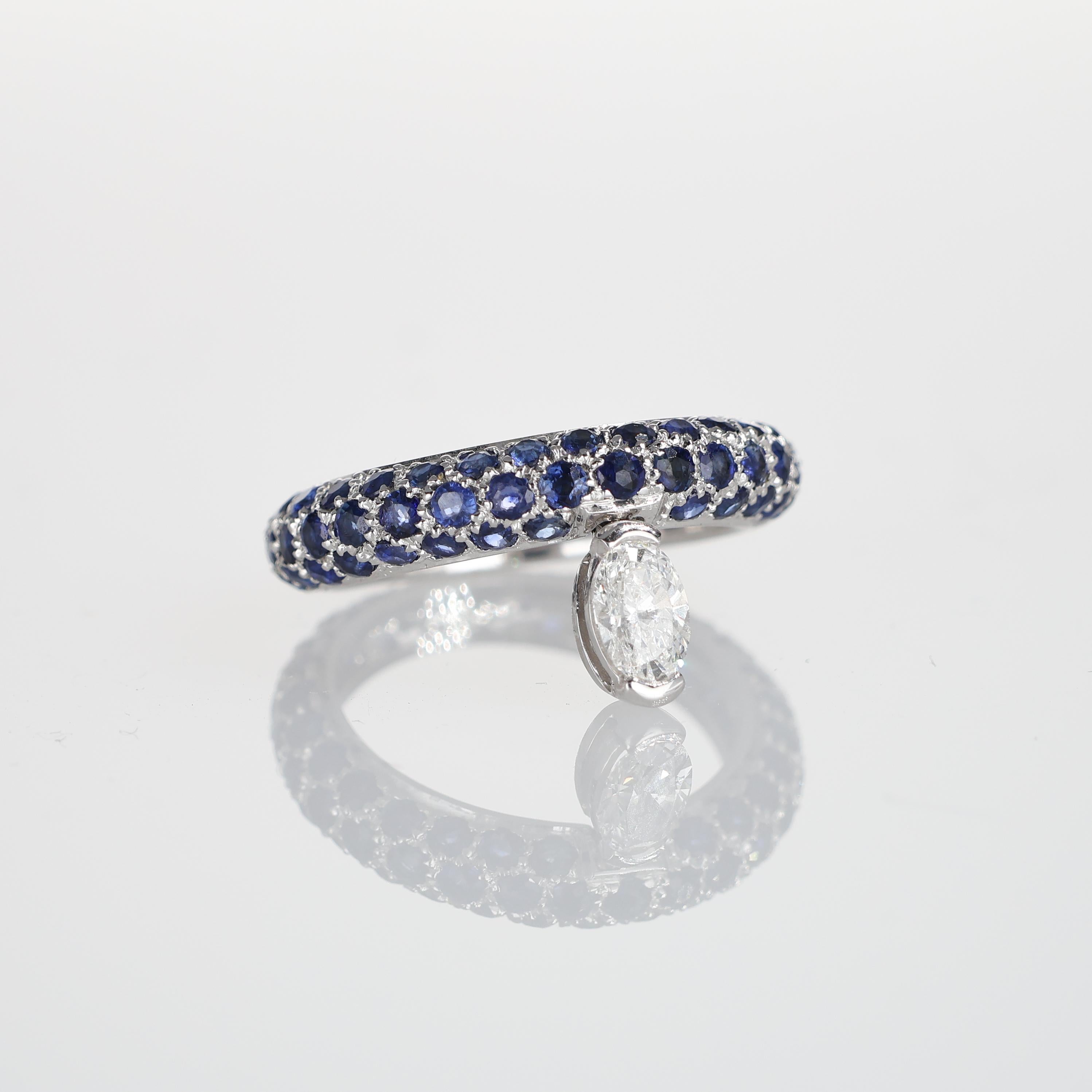 Brilliant Cut 18K White Gold Sapphire Pavé Ring with Suspended Oval Diamond For Sale