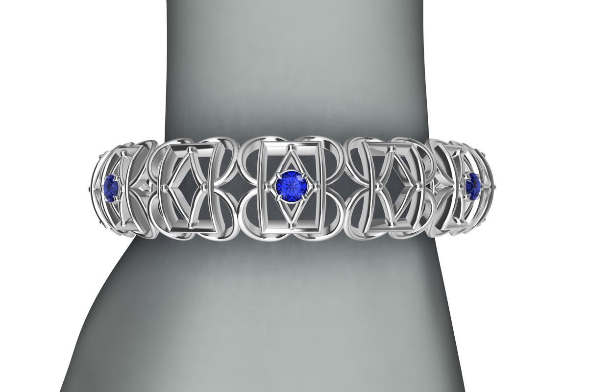 18k White Gold Sapphire Rectangle Rhombus Bangle, from the Gates series. This bracelet is inspired from hand wrought ironwork off balconies, windows, and gates in Europe. A modern twist with 7 Ceylon color diamond cut sapphires,  2.8 carats  Made to