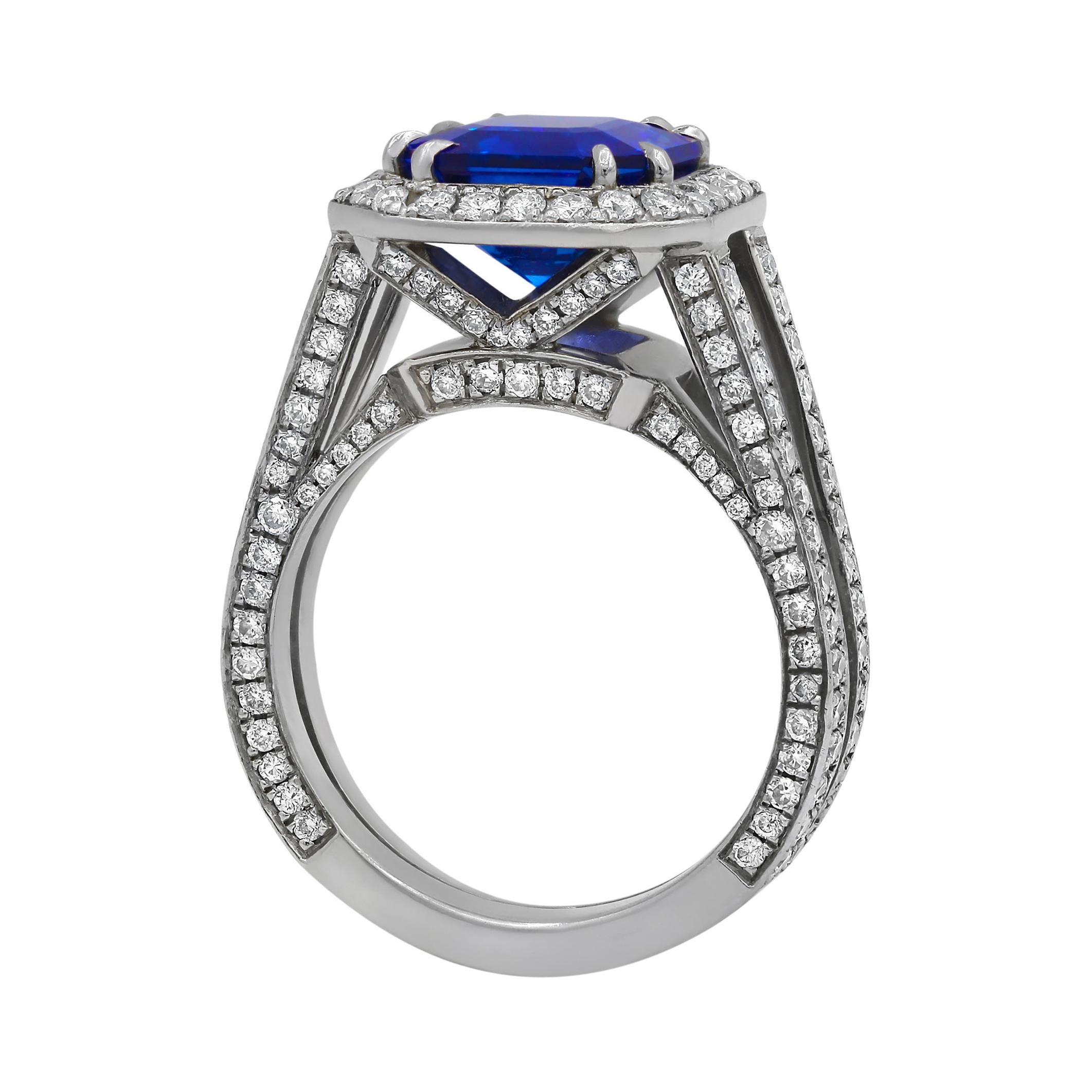 18k white gold sapphire ring features 3.98ct sapphire with 1.20 cts of round diamonds creating halo and split shank

