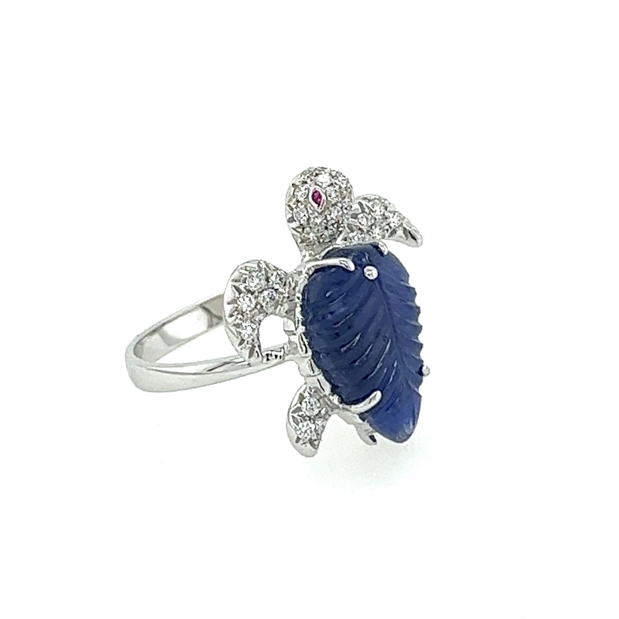 18K  White Gold Sapphire Turtle Ring with Rubies & Diamonds
1 Blue Sapphire - 4.60 CT
36 Diamonds - 0.31 CT
2 Rubies - 0.01 CT
18K White Gold 4.10 GM

Turtle represents intuitive development, protection, wisdom, patience, and determination. As a