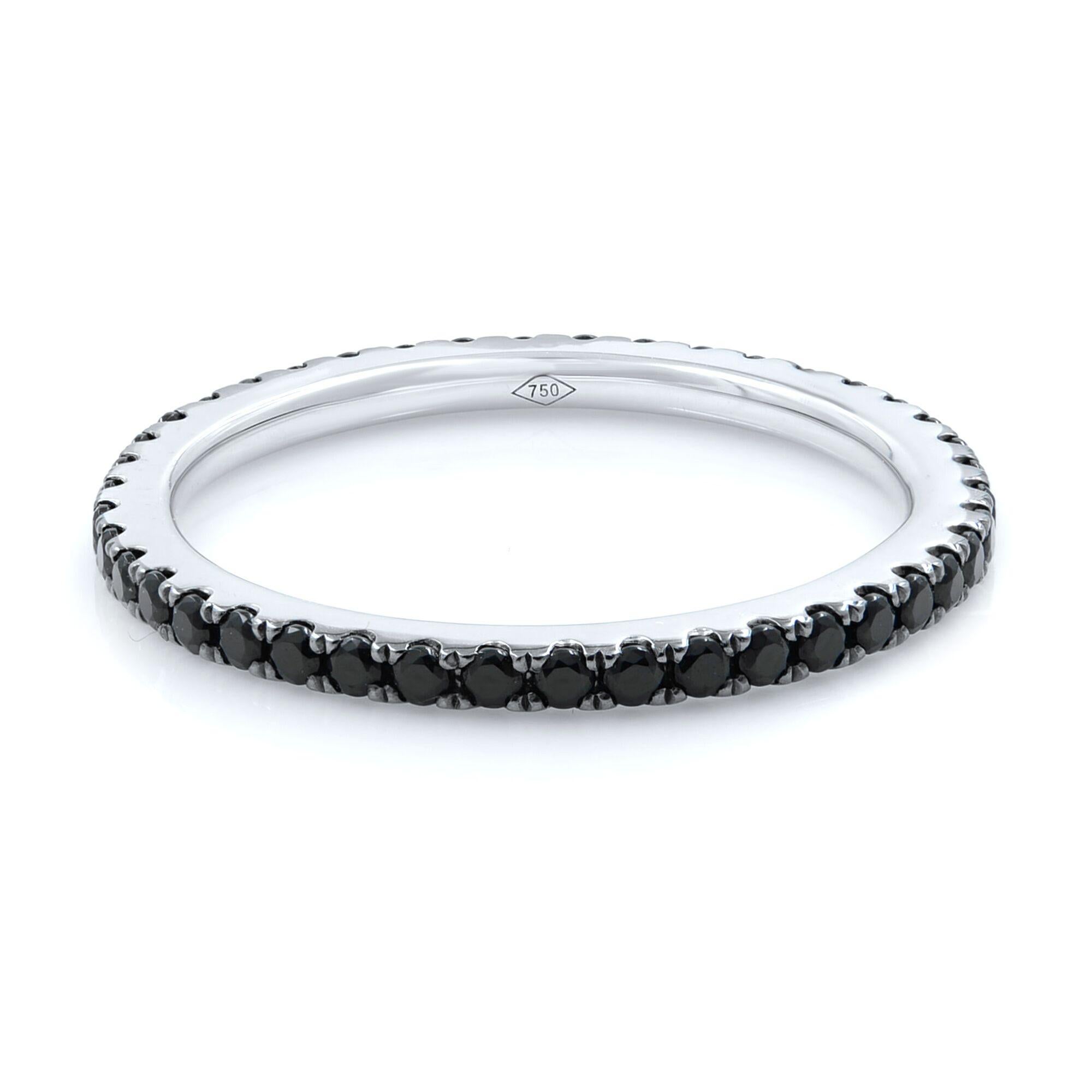 Dainty black diamond pave set eternity ring crafted in 18k white gold set with 0.54cts of natural black diamonds. 
Size: 6
Weight: 1.5 grams
