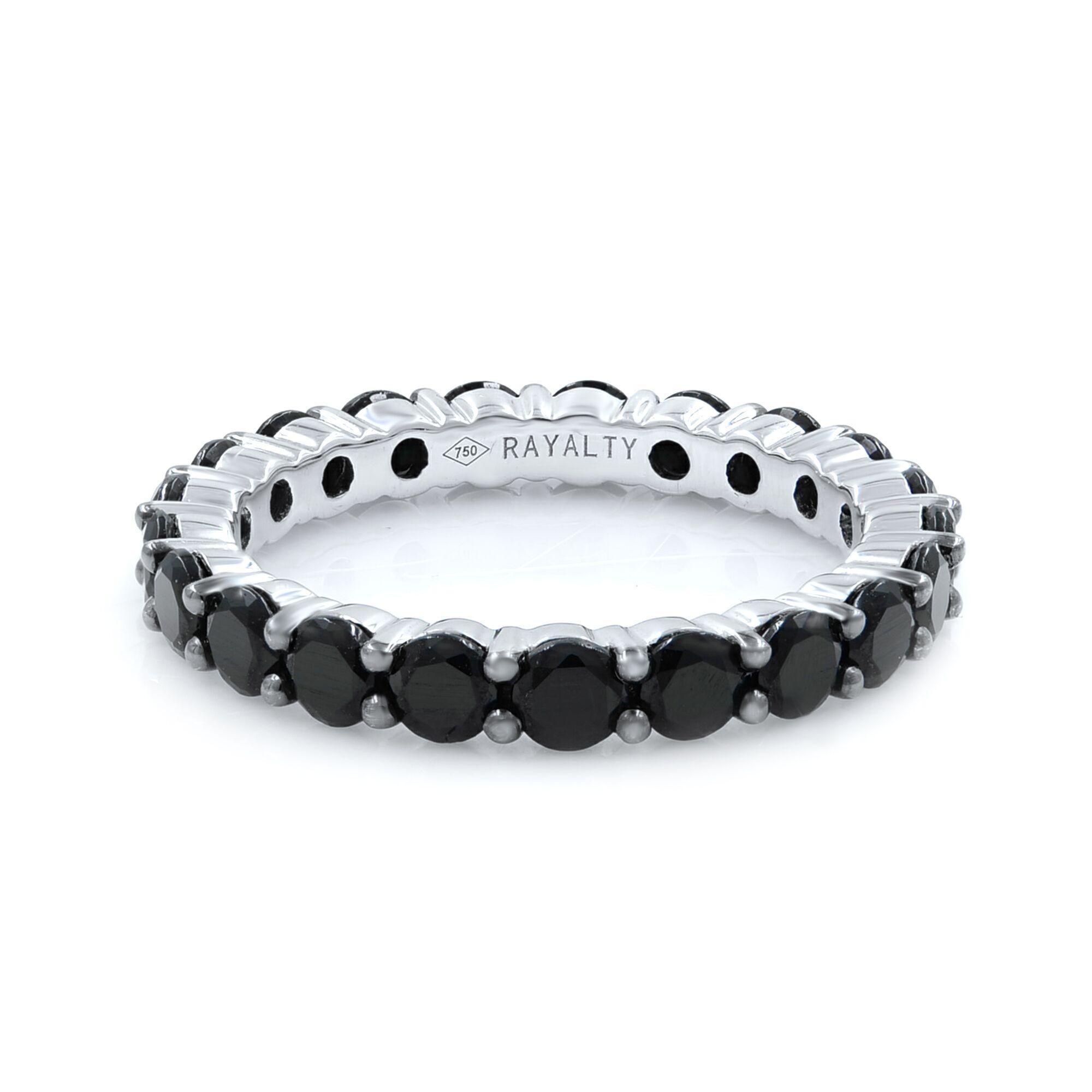 18K white gold eternity band prong set with round brilliant cut black diamonds weighing 2.13 carats combined total weight.
Size: 5.25
Can be ordered in size of your choice. 