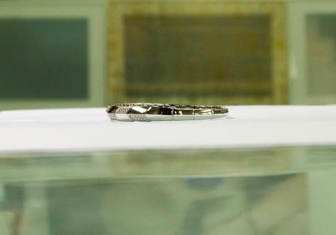 •	Metal: 18K White Gold 
•	Weight: 9.94gm 
•	Gemstones: Natural Diamonds
•	Total Diamond Weight: 0.55 ct (80 stones)
•       Diameter of bracelet: 1.8 inch - 2.3 inch

Inspired by the timeless beauty and strength of Idunn, this sophisticated bangle