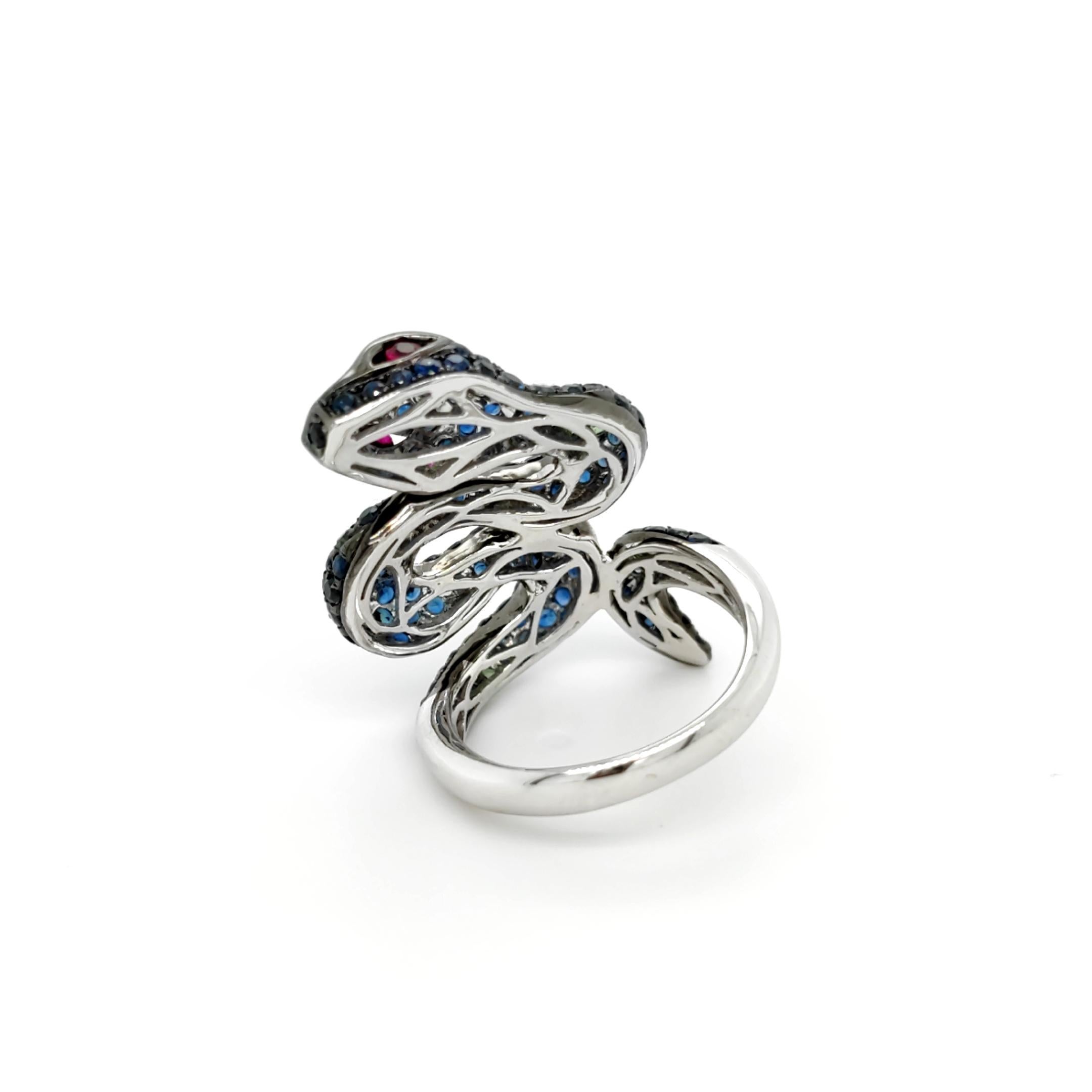 Modern 18K White Gold Snake Blue Sapphire Green Garnet & Ruby Ring For Sale