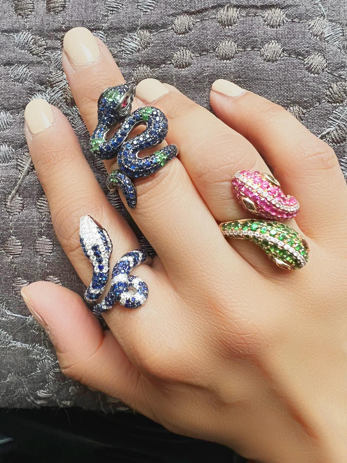 18K White Gold Snake Blue Sapphire & Ruby Diamond Ring
US Size: 6.5

146 Blue Sapphires - 1.87 CT
75 Diamonds - 0.83 CT
2 Rubies - 0.10 CT
18K White Gold - 8.40 GM

Our new ring collection celebrate the nature and the beauty of it. Snake is a symbol