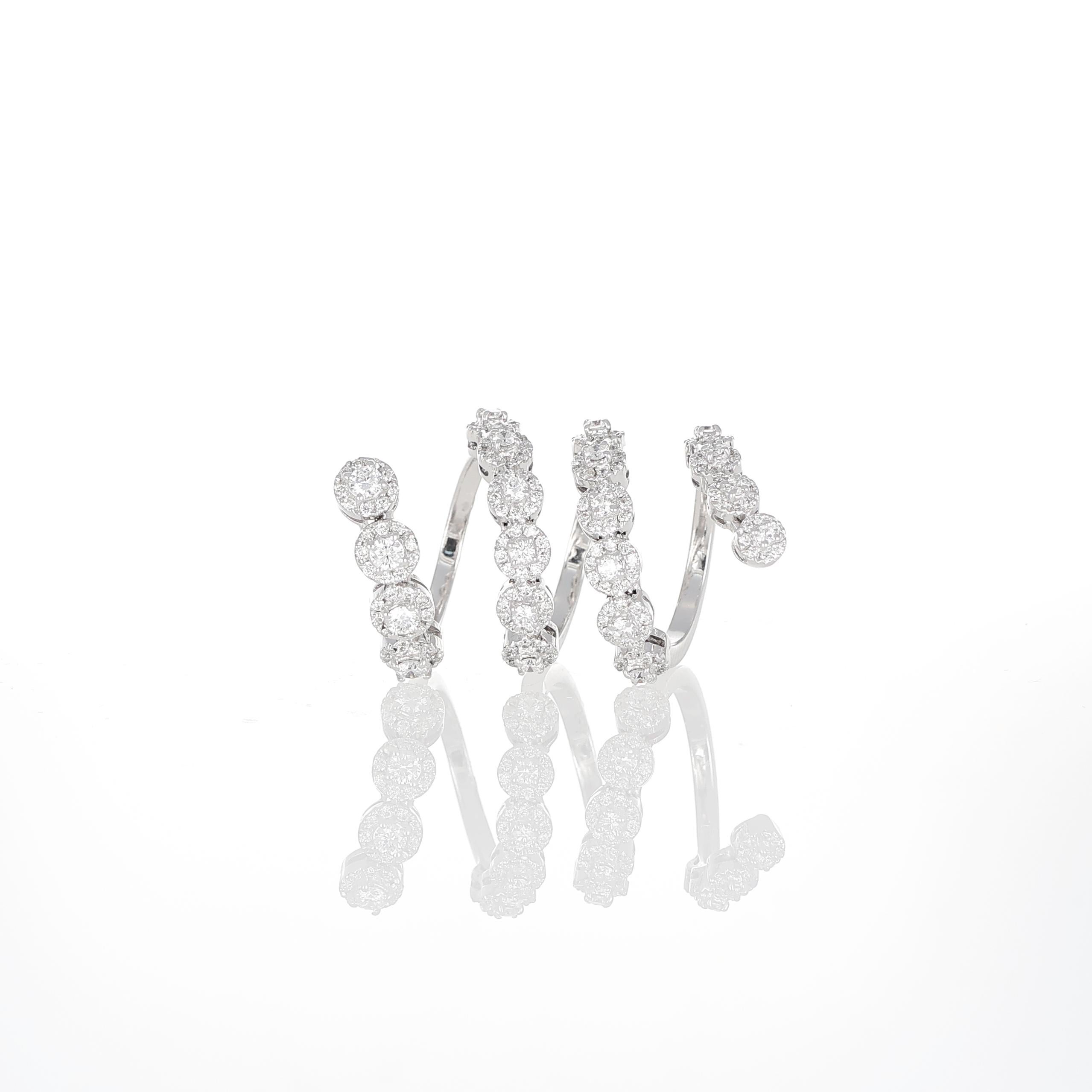 A bold and contemporary interpretation of fluid design, this 18K white gold snake ring coils elegantly around the finger, set with 2.20 carats of brilliant-cut diamonds. The graduated diamonds follow the sinuous curves of the ring, enhancing its