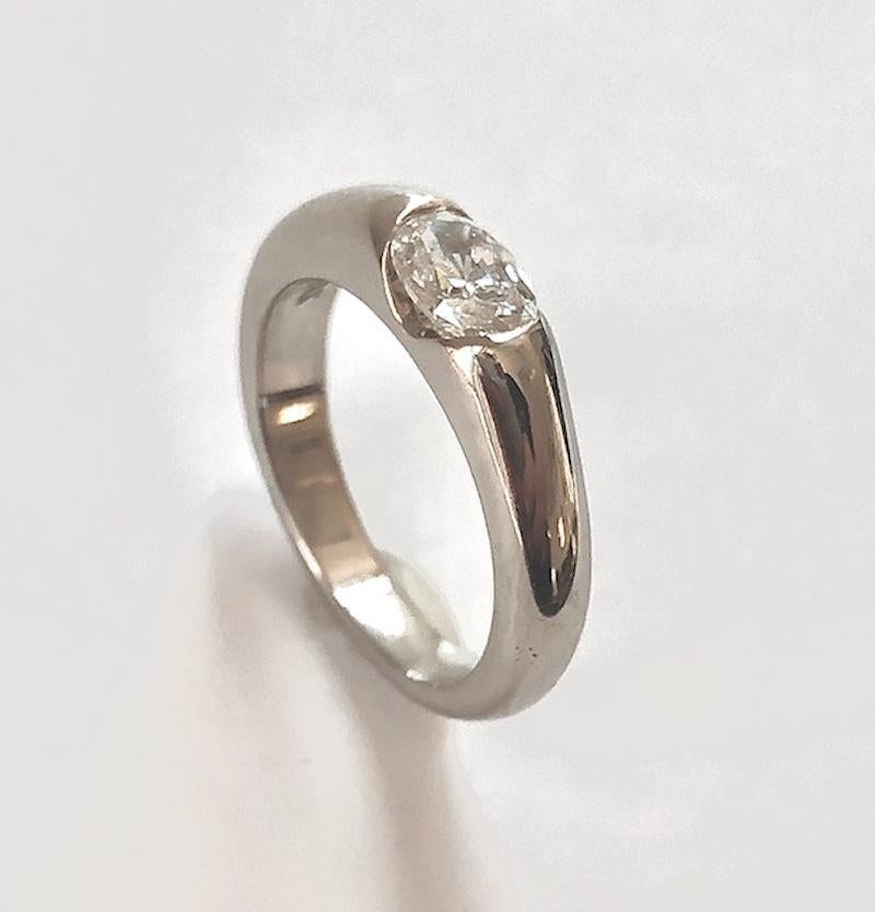 Clean and smooth lines for this modern solitaire ring, made in 18k White Gold and set with a fine quality Oval Diamond 0.57 carats.

We design and manufacture all our jewelry at our workshop, located in New York City's diamond district.