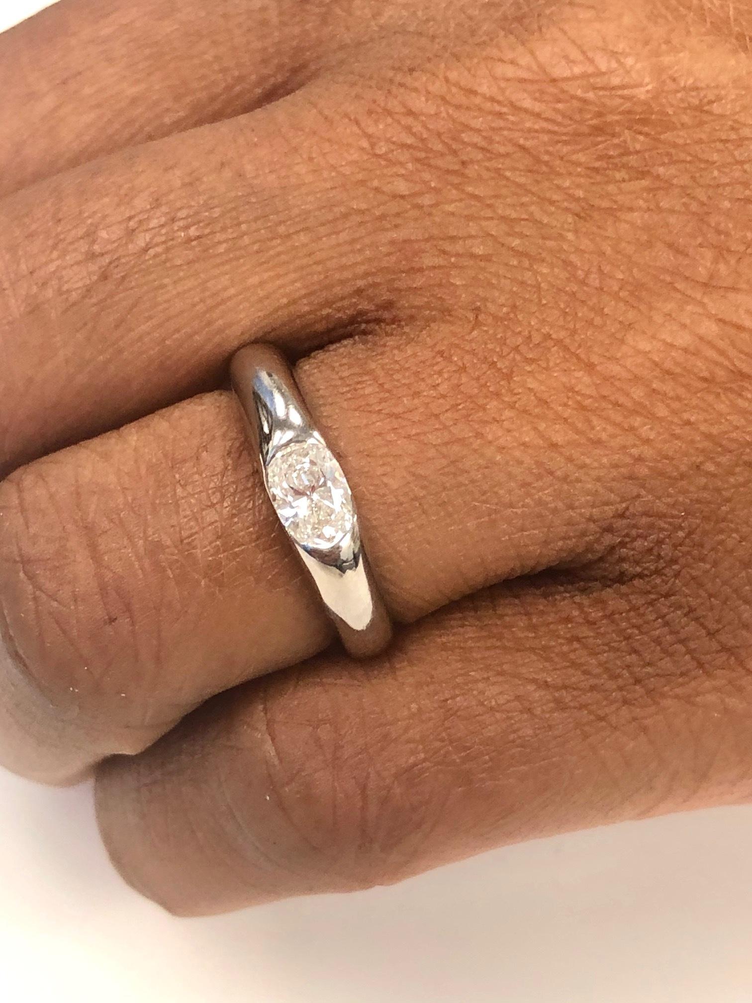 Women's or Men's 18 Karat White Gold Solitaire Oval Diamond Ring For Sale