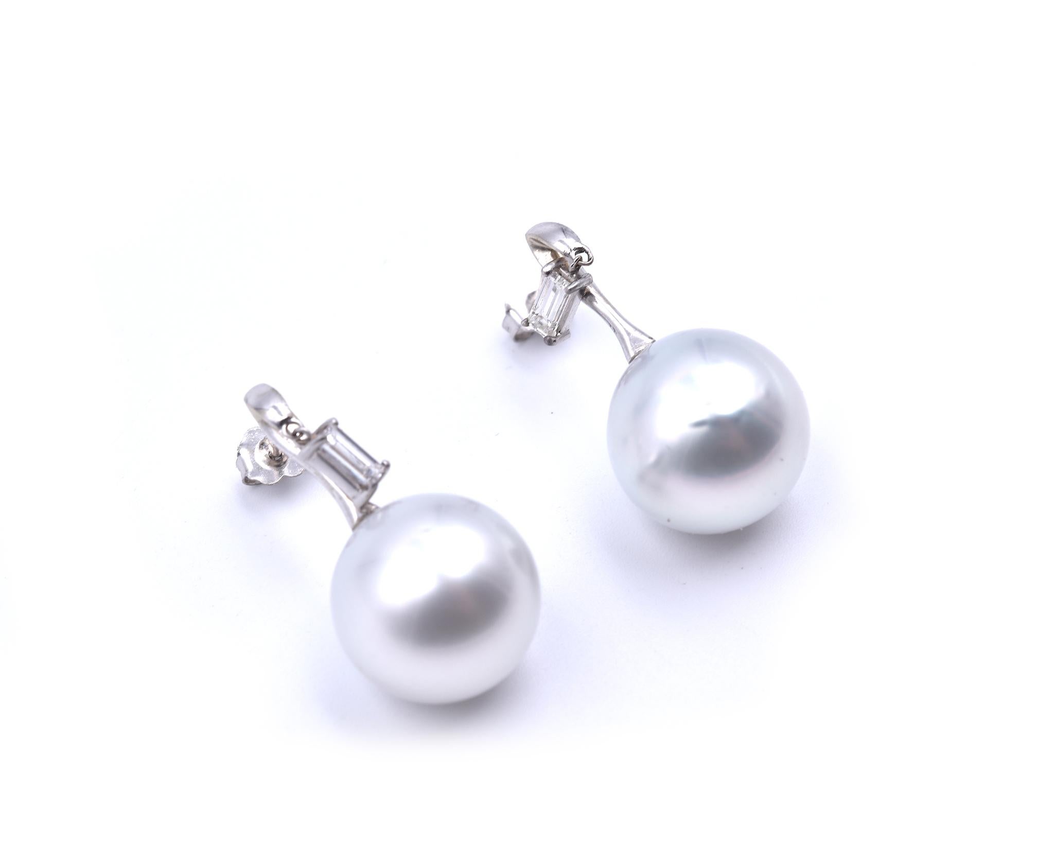 Designer: custom design
Material: 18k white gold
Diamonds: 2 emerald cut =.60cttw
Color: G
Clarity: VS
Pearls: South Sea Pearls are approximately 15.47mm in diameter 
Fastenings: post
Dimensions: each earring is approximately 29.65mm long
Weight: