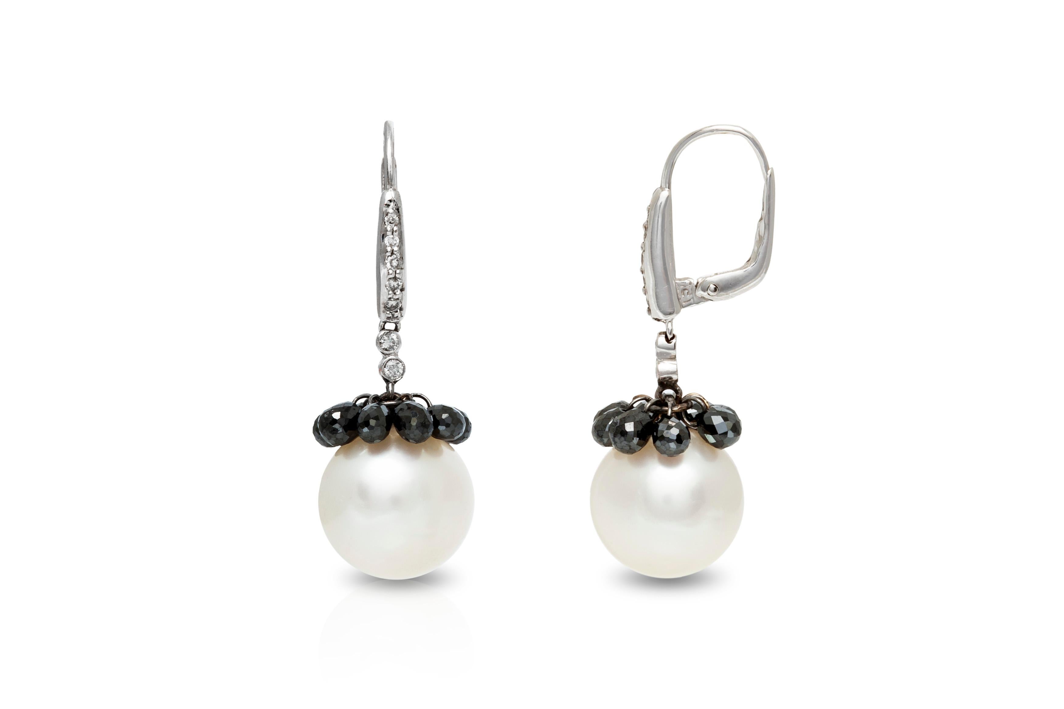 The earrings is finely crafted in 18k white gold with black diamonds weighing approximately total of 6.10 and diamonds weighing approximately total of 0.17 and southseapearl.
Very elegant earrings for day and night.
