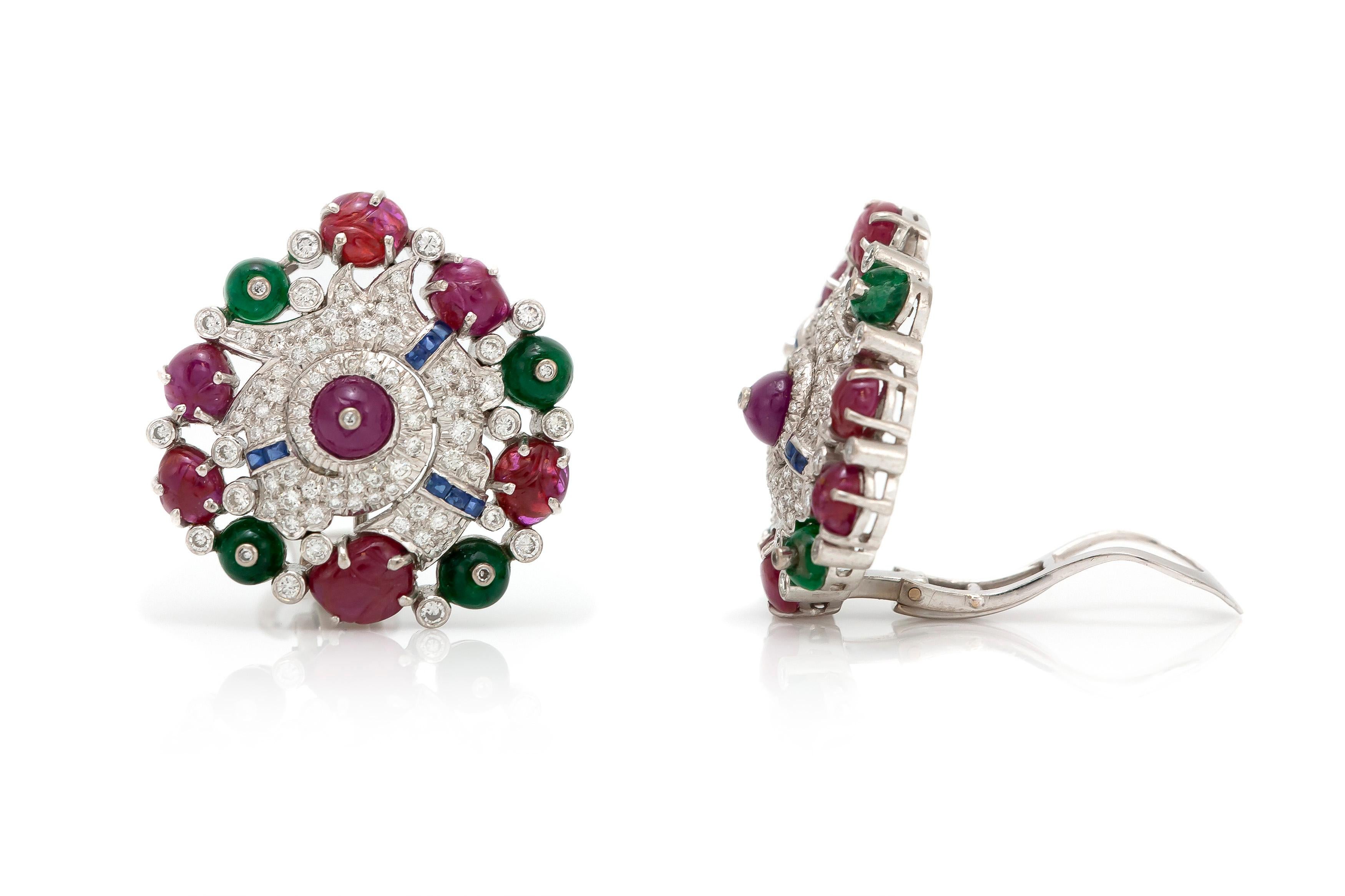 The earrings is finely crafted in 18k white gold with diamonds weighing approximately totaal of 4.00 carat ,ruby weighing approximately total of 4.90, emeralds weighing approximately total of 2.40 carat and sapphire weighing approximately total of